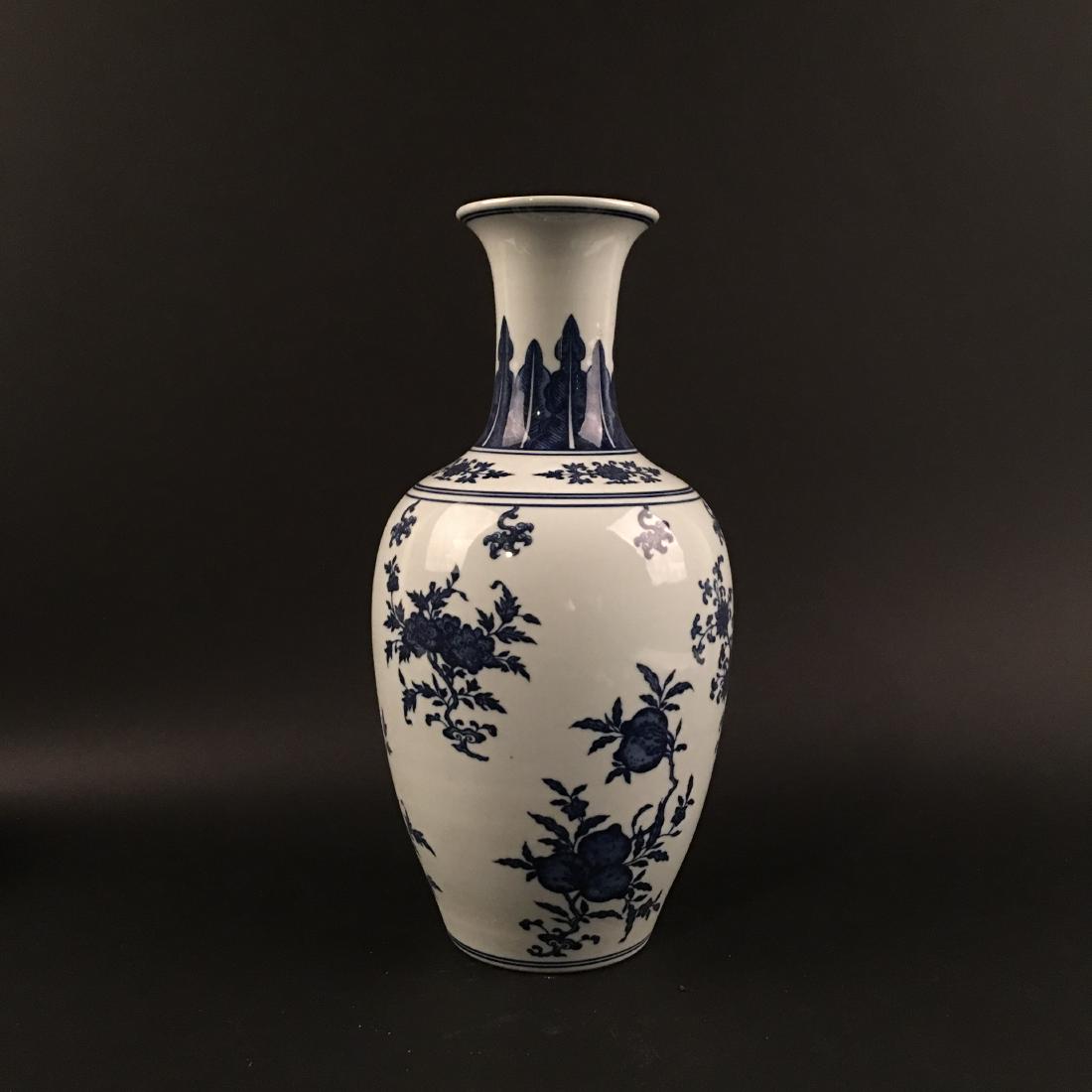 Chinese Blue-White 'Pomegranate' Vase, Qianlong mark: Chinese Blue-White 'Pomegranate' Vase, Qianlong mark 15-1/4'' H, 6-1/2'' W; 2876 g Shipping: We are able to pack and ship this item to an address in the United States for $35.00 via UPS Ground or USPS