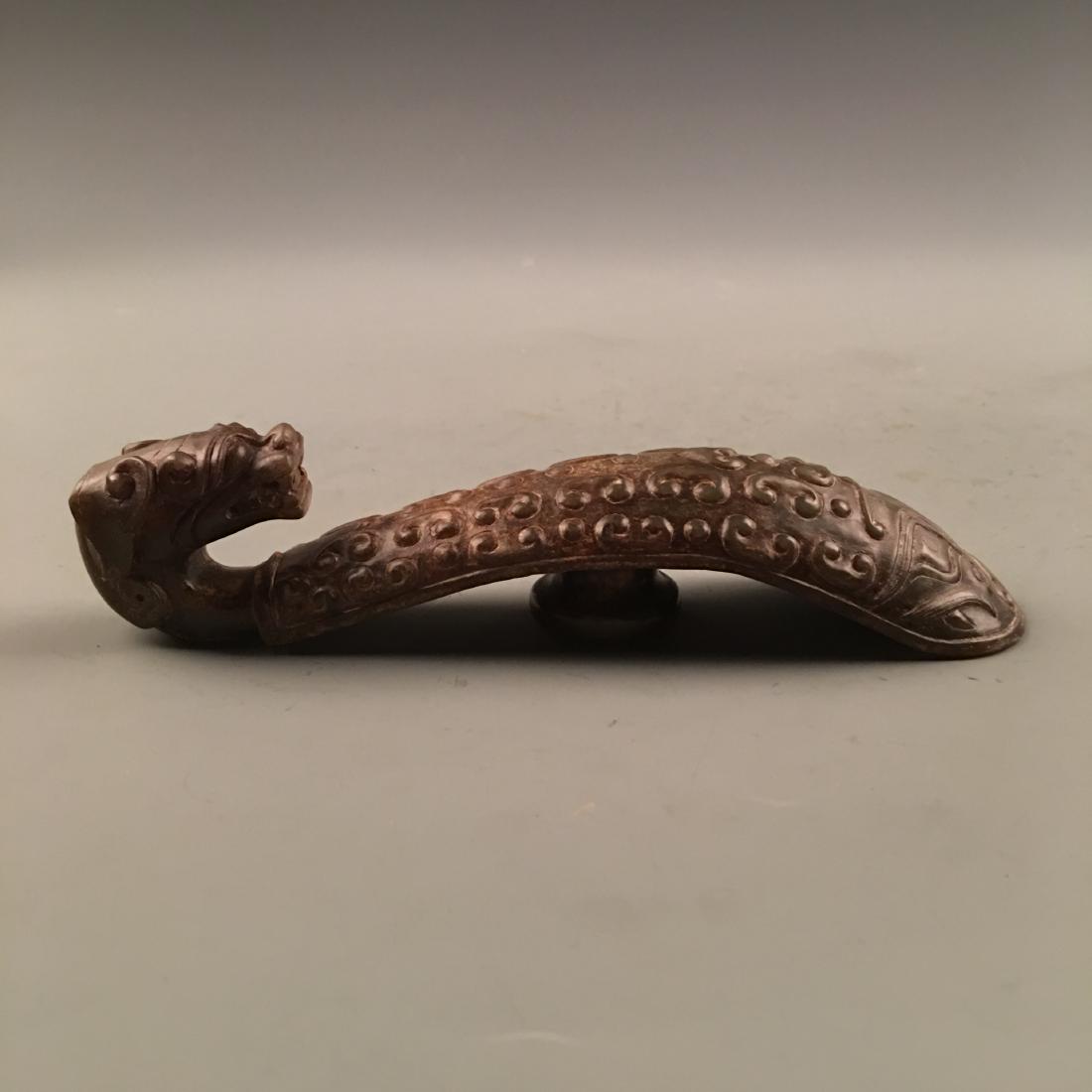 Chinese Archaic Jade Belt Buckle: Chinese Archaic Jade Belt Buckle 1-1/2'' H, 1-5/8'' W; 237 g Shipping: We are able to pack and ship this item to an address in the United States for $25.00 via UPS Ground or USPS Priority Mail. Tracki