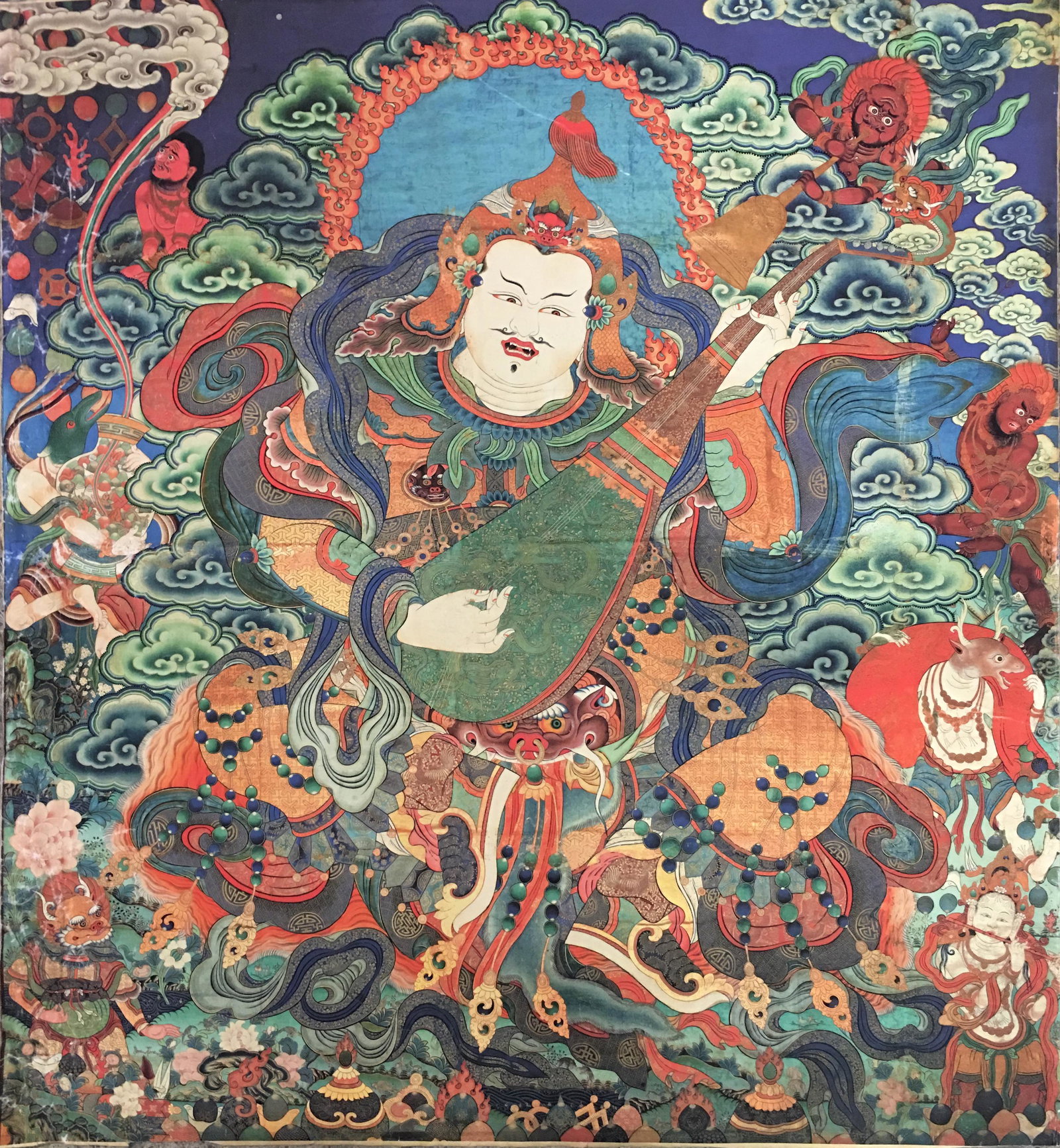 Thangka Painting of Dhritarashtra: 35-1/2'' H, 32-1/2'' W; 0.2 lb Shipping: We are able to pack and ship this item to an address in the United States for $25.00 via UPS Ground or USPS Priority Mail. Tracking information will be sent to