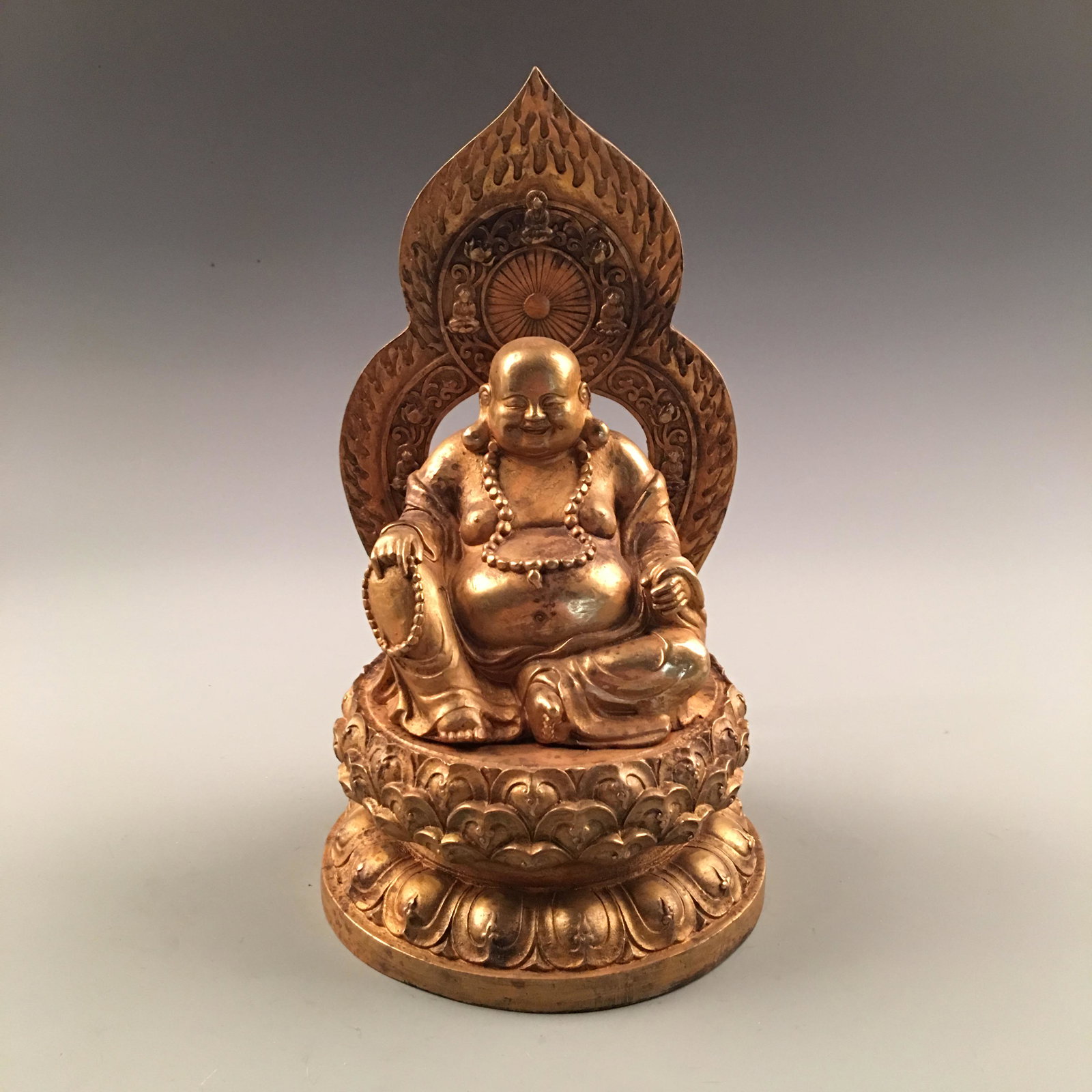 Chinese Gilt Bronze Sitted Happy Buddha: Chinese Gilt Bronze Sitted Happy Buddha 11-5/8'' H, 6'' W; 7.8 lb Shipping: We are able to pack and ship this item to an address in the United States for $35.00 via UPS Ground or USPS Priority Mail. T