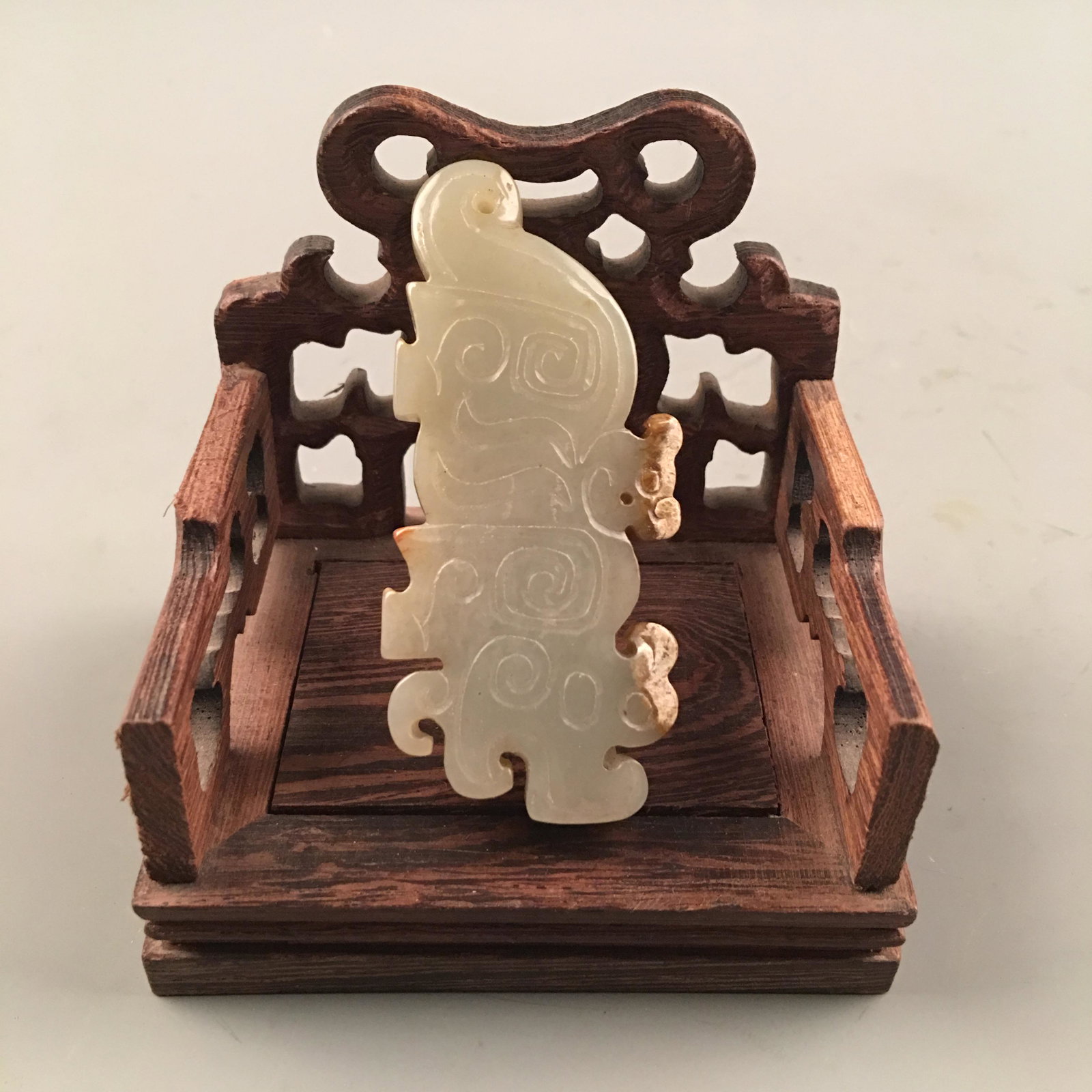 Chinese Carved Archaic Jade Pendant: Chinese Carved Archaic Jade Pendant 1-1/4'' H, 2-3/4'' W; 42 g Shipping: We are able to pack and ship this item to an address in the United States for $25.00 via UPS Ground or USPS Priority Mail. Trac