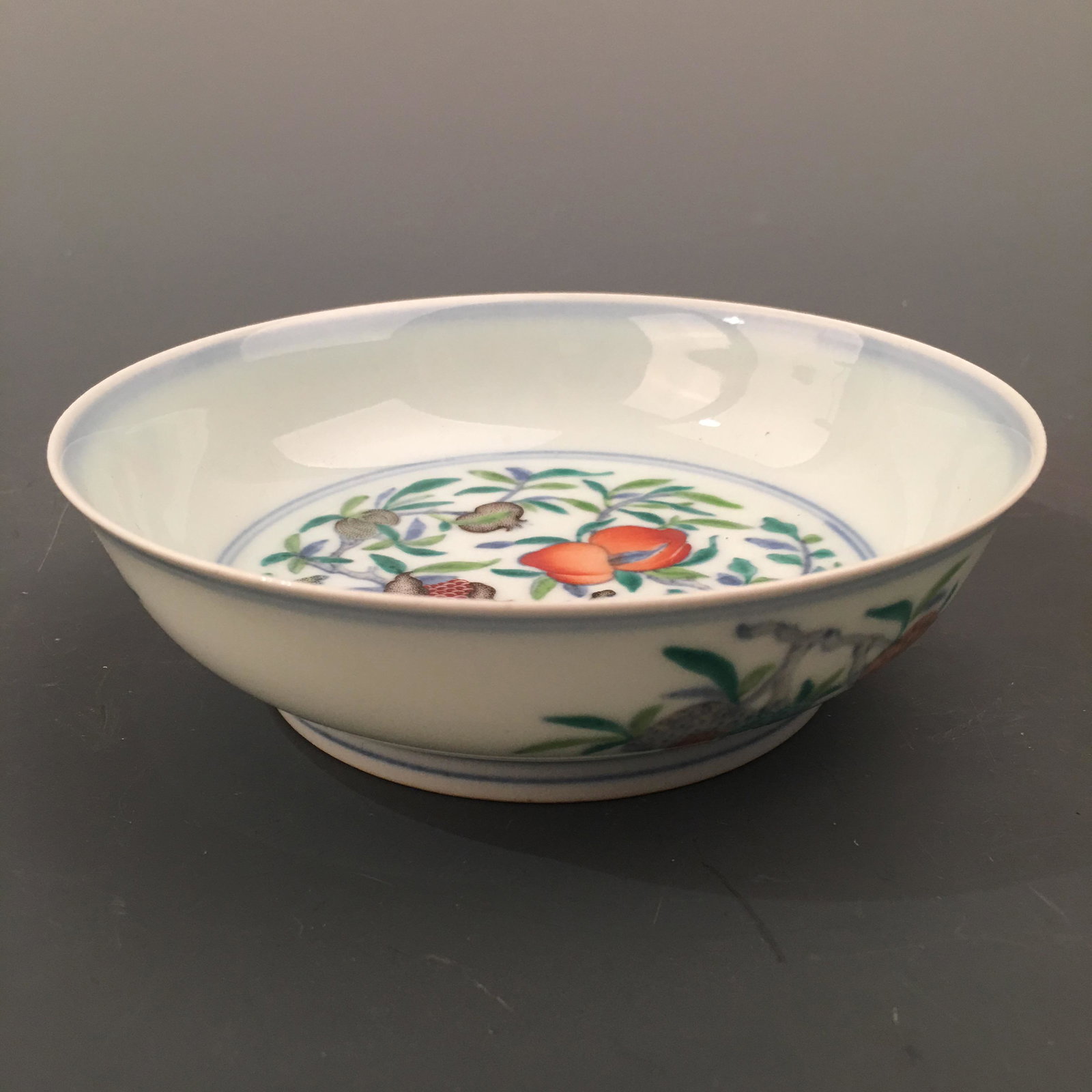Chinese Famille Rose Peach Plate, Yongzheng Mark: Chinese Famille Rose Peach Plate, Yongzheng Mark 1-1/2'' H, 5-1/2'' W; 135 g Shipping: We are able to pack and ship this item to an address in the United States for $35.00 via UPS Ground or USPS Prior