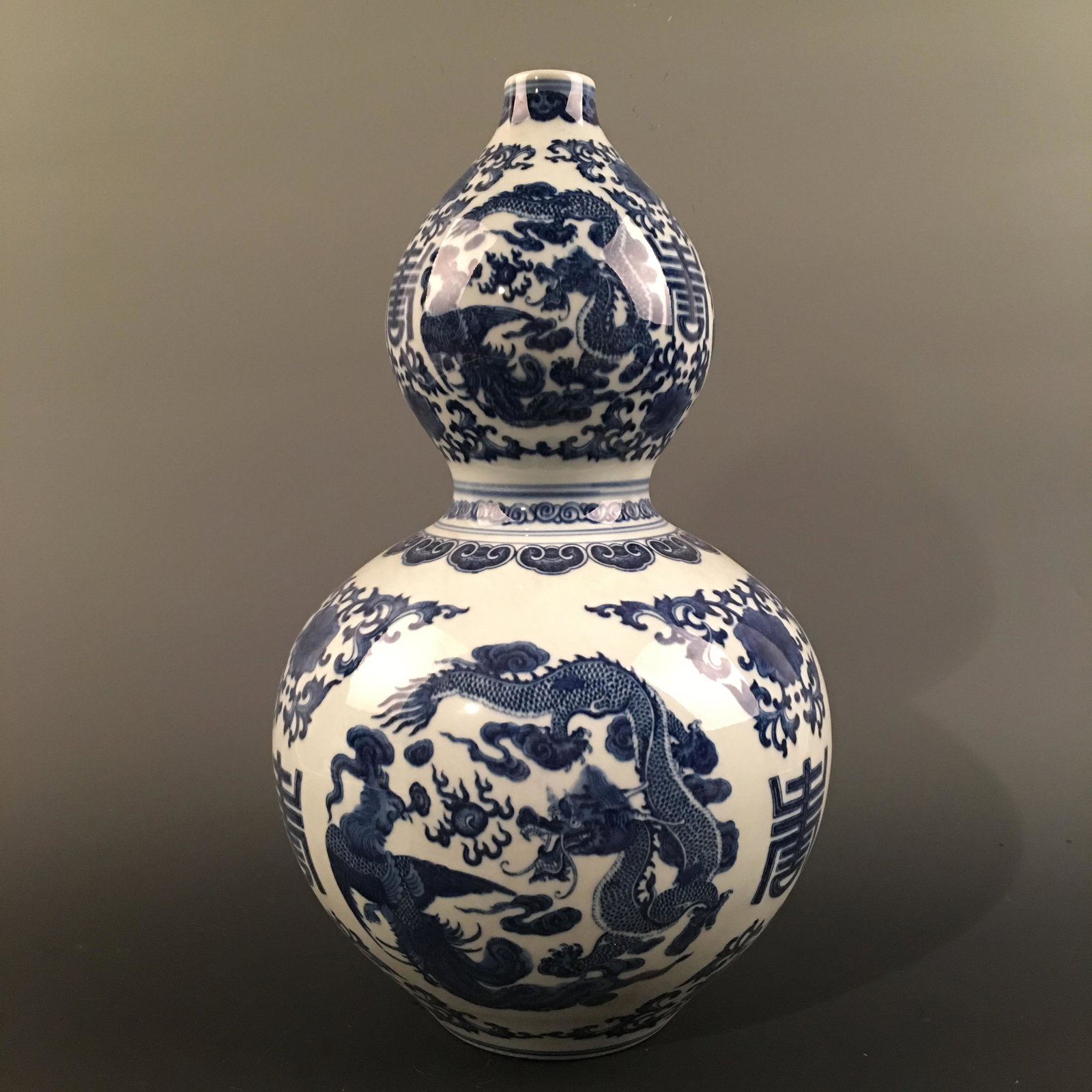 Chinese Blue-White 'Dragon' Standing Bowl: Chinese Blue-White 'Dragon' Standing Bowl 15'' H, 8'' W; 3.4 lb Shipping: We are able to pack and ship this item to an address in the United States for $40.00 via UPS Ground or USPS Priority Mail. Tra