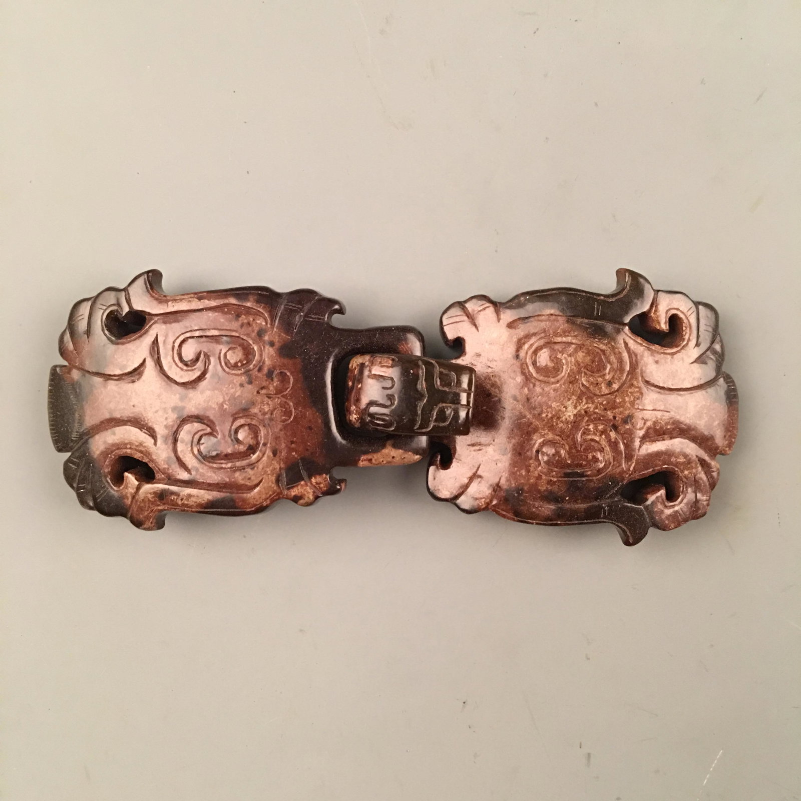 Chinese Archaic Jade Belt Buckle: Chinese Archaic Jade Belt Buckle 1-3/4'' H, 5'' L; 106 g Shipping: We are able to pack and ship this item to an address in the United States for $25.00 via UPS Ground or USPS Priority Mail. Tracking i