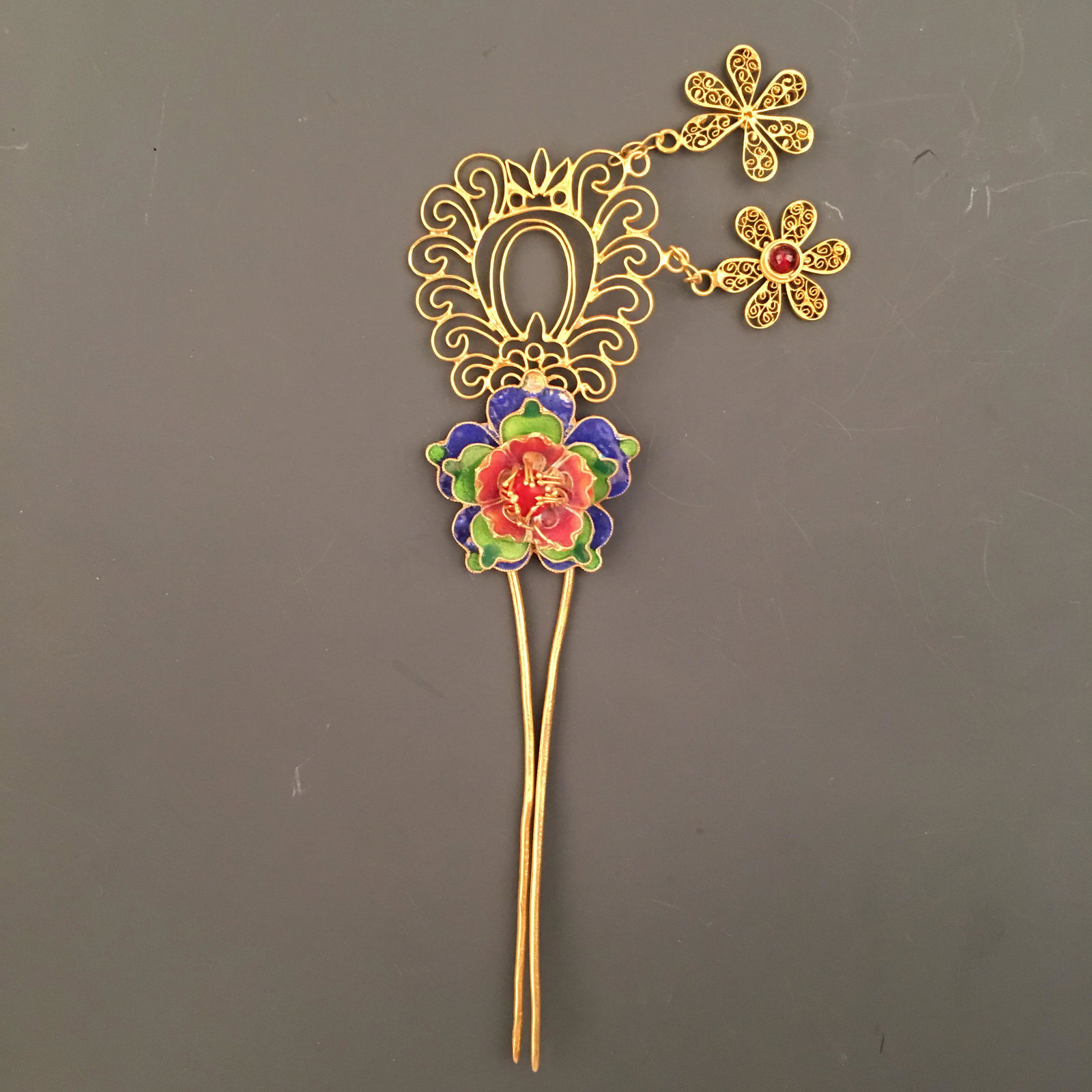Chinese Gilt Silver Enamel 'Floral' Hair Clasp: Chinese Gilt Silver Enamel 'Floral' Hair Clasp 6'' H, 2'' W; 25 g Shipping: We are able to pack and ship this item to an address in the United States for $30.00 via UPS Ground or USPS Priority Mail. T