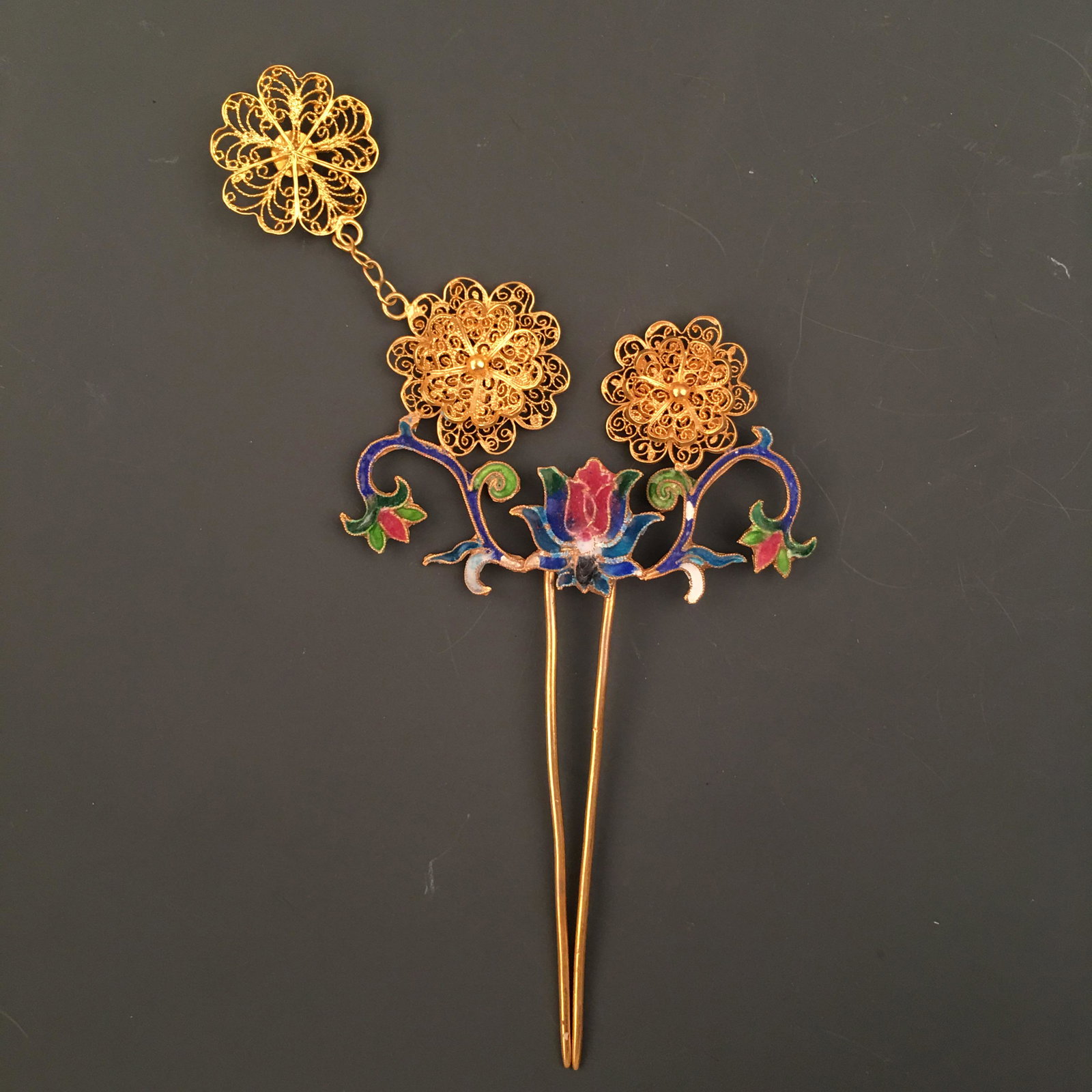 Chinese Gilt Silver Enamel 'Floral' Hair Clasp: Chinese Gilt Silver Enamel 'Floral' Hair Clasp 5'' H, 2-1/4'' W; 19 g Shipping: We are able to pack and ship this item to an address in the United States for $30.00 via UPS Ground or USPS Priority Mai
