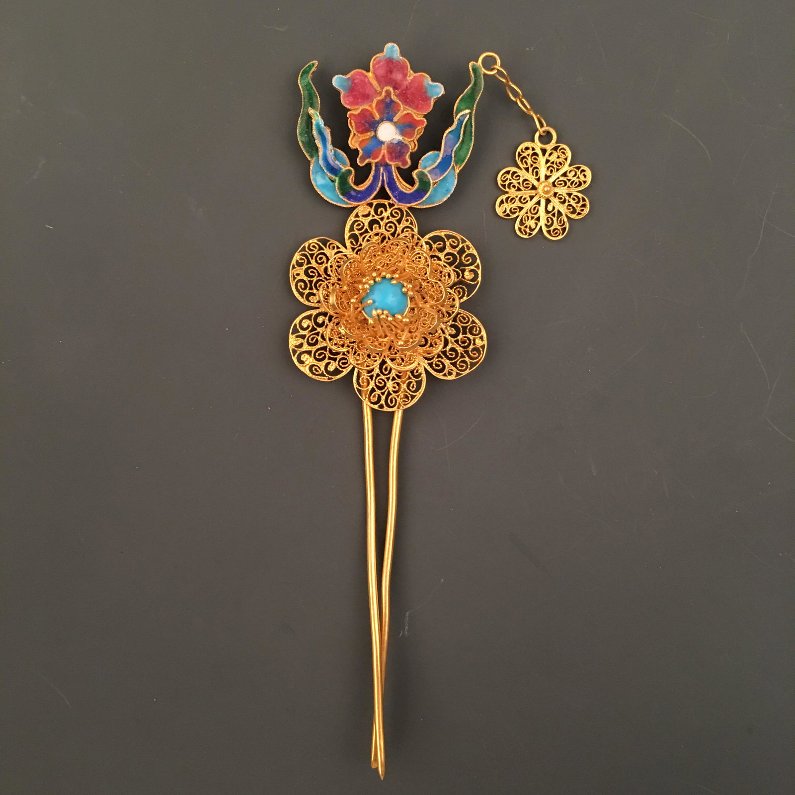 Chinese Gilt Silver Enamel 'Floral' Hair Clasp: Chinese Gilt Silver Enamel 'Floral' Hair Clasp 5-1/4'' H, 1-3/4'' W; 24 g Shipping: We are able to pack and ship this item to an address in the United States for $30.00 via UPS Ground or USPS Priority