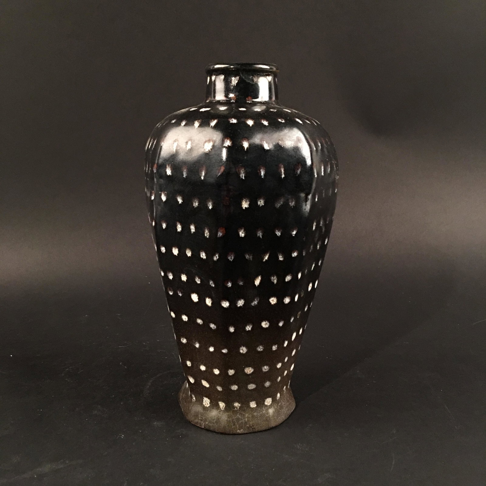Chinese Jizhou Kiln Meiping Vase: Chinese Jizhou Kiln Meiping Vase 9-1/8'' H, 5-3/8'' W; 1.8 lb Shipping: We are able to pack and ship this item to an address in the United States for $35.00 via UPS Ground or USPS Priority Mail. Track