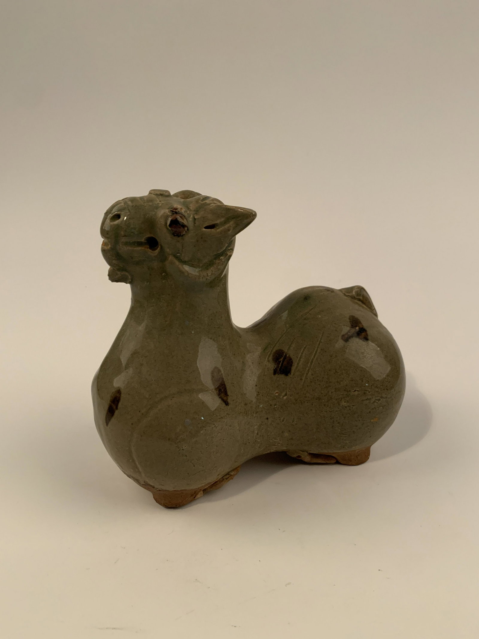 Chinese Yue Kiln Figure of Sheep: Chinese Yue Kiln Figure of Sheep 7'' H, 7-1/2'' W; 3 lb Shipping: We are able to pack and ship this item to an address in the United States for $30 via UPS Ground or USPS Priority Mail. Tracking infor
