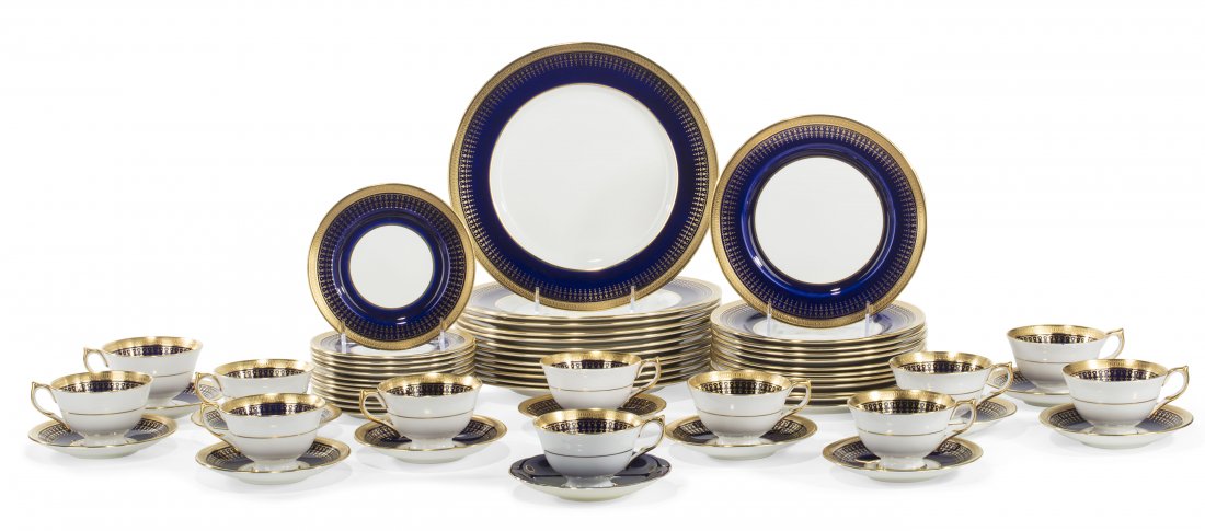 An Aynsley bone china part dinner service 20th century: An Aynsley bone china part dinner service20th centuryComprising twelve 10 1/2in dinner plates, twelve 8 1/4in luncheon plates, twelve 6 1/4in bread & butter plates, twelve tea cups and eleven saucers 