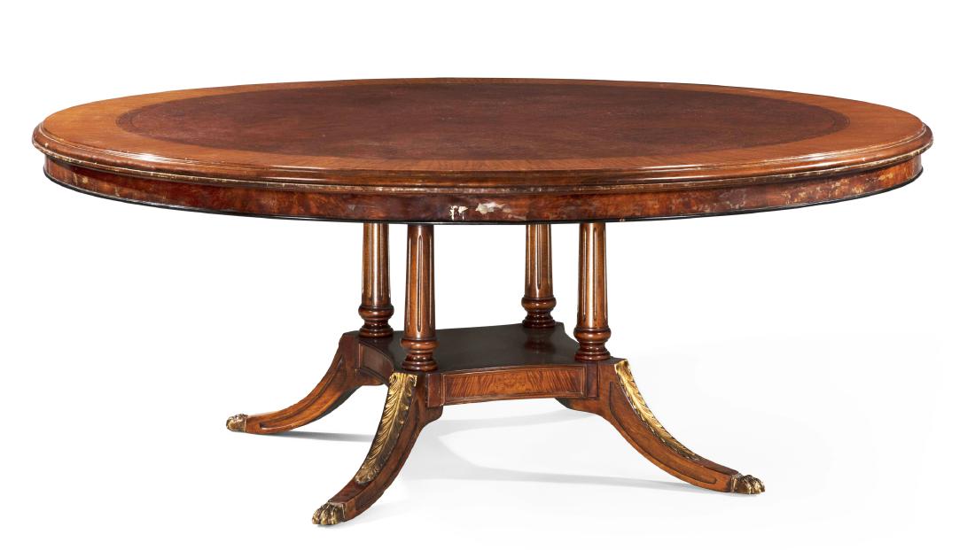 A Regency style mixed wood circular dining table (1 of 2)