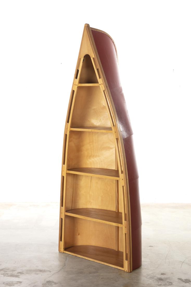 A whimsical painted canoe form bookshelf (1 of 3)