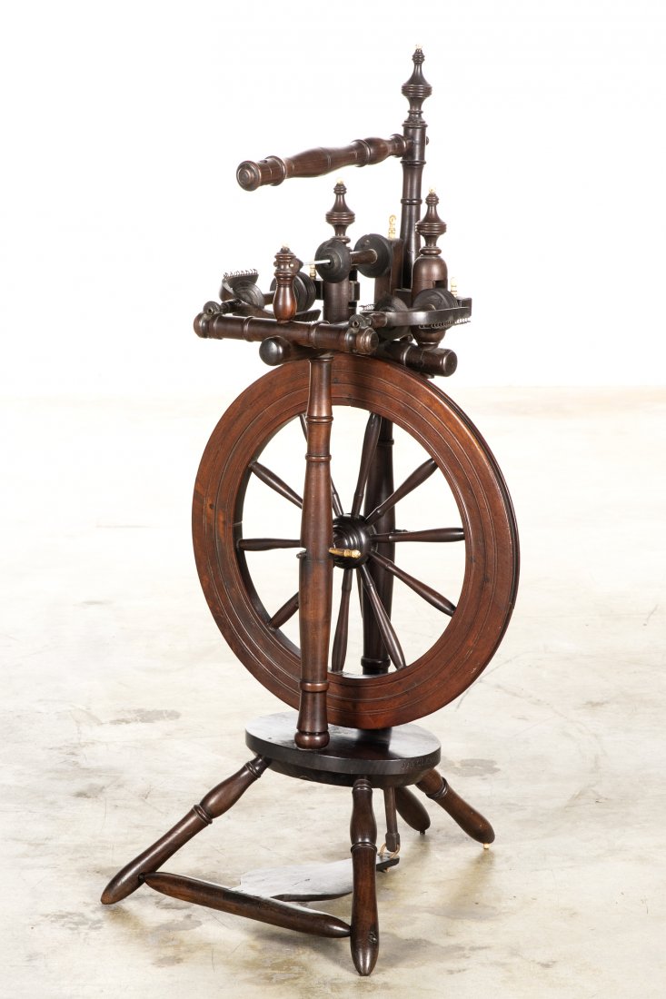 A Continental castle upright spinning wheel