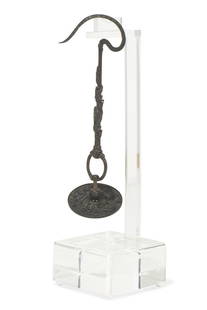 A Chinese bronze bird cage hook: A Chinese bronze bird cage hook Intricately decorated and inscribed. length 7in (18cm)