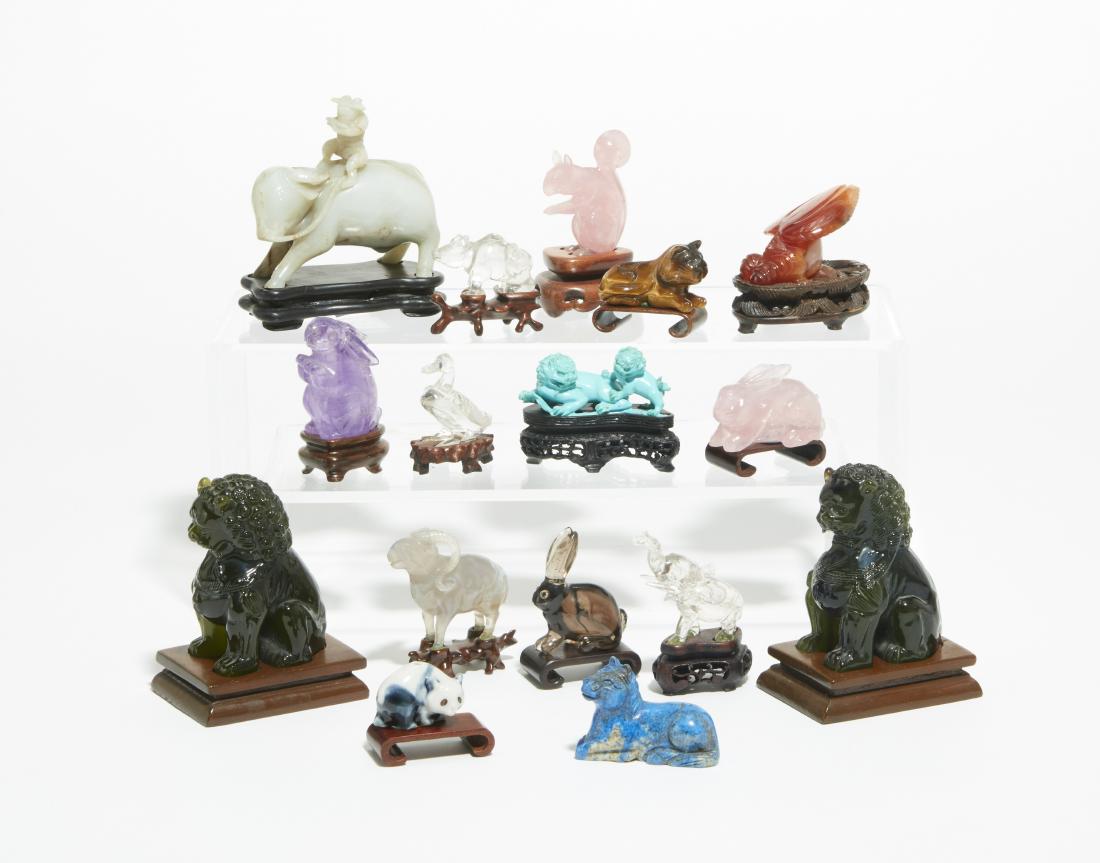 Group of fifteen Chinese carved hardstone animals: A group of fifteen Chinese carved hardstone animals 20th century Including foo dogs, rabbits, horses, an ox and others; together with a porcelain panda (16)