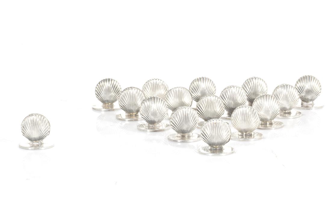 Tiffany & Co. silver shell form menu card holders: A set of sixteen American sterling silver shell form menu card holders Tiffany & Co., New York, NY modern each height 1in (2.5cm); total weight approximately 5oz troy