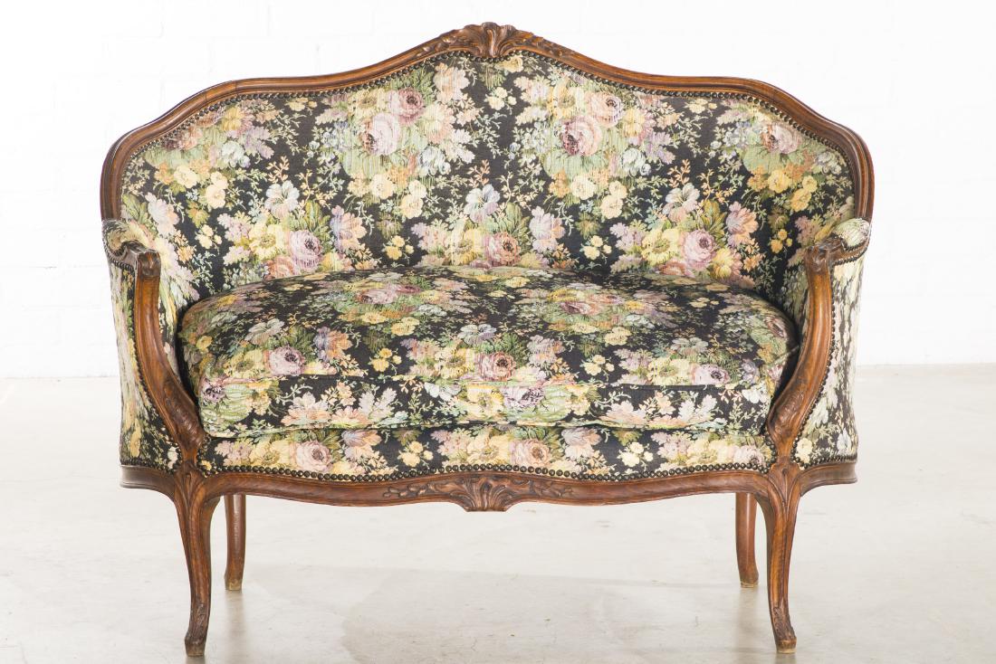 A Louis XV style carved beechwood canape: A Louis XV style carved beechwood canapÃ© circa 1900 height 40in (102cm); width 51 1/2in (131cm); depth of seat 22in (56cm)