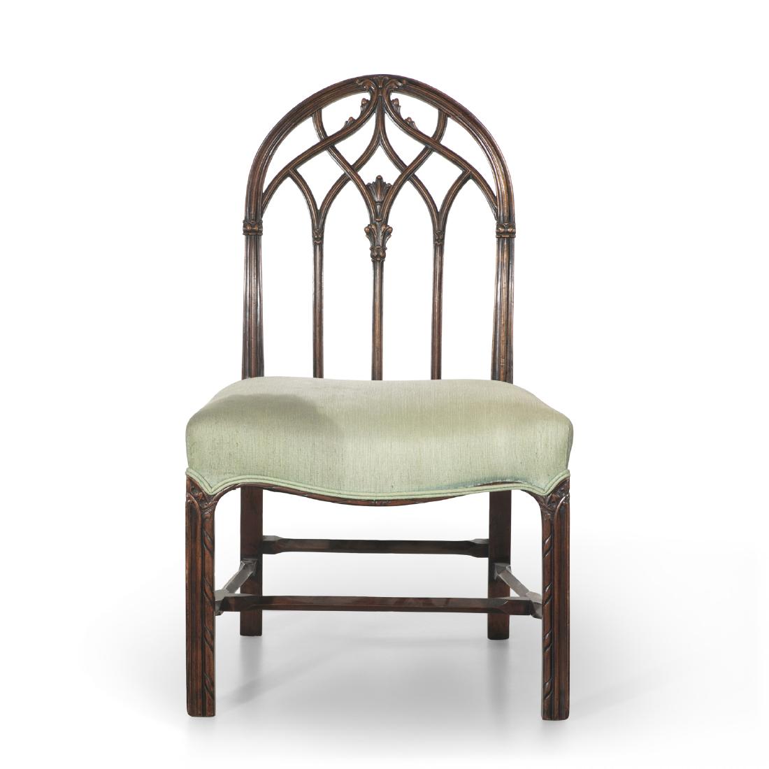 A Gothic Revival carved mahogany side chair (1 of 2)