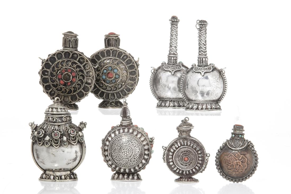 Eight Mongolian style metalware snuff bottles: A group of eight Mongolian style stone mounted metalware snuff bottles 20th century height of largest pair 3in (7.5cm) Provenance: Property from the Estate of Jack Levin, Los Angeles, California.