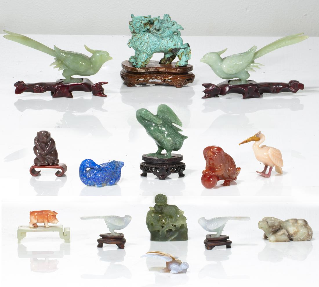 Chinese hardstone figures of animals and birds: A collection of fourteen Chinese carved hardstone figures of animals and birds 20th century Including birds, temple lions, a carp, a pig, an ox and a monkey. the largest height 3in (7.5cm); length 3 3