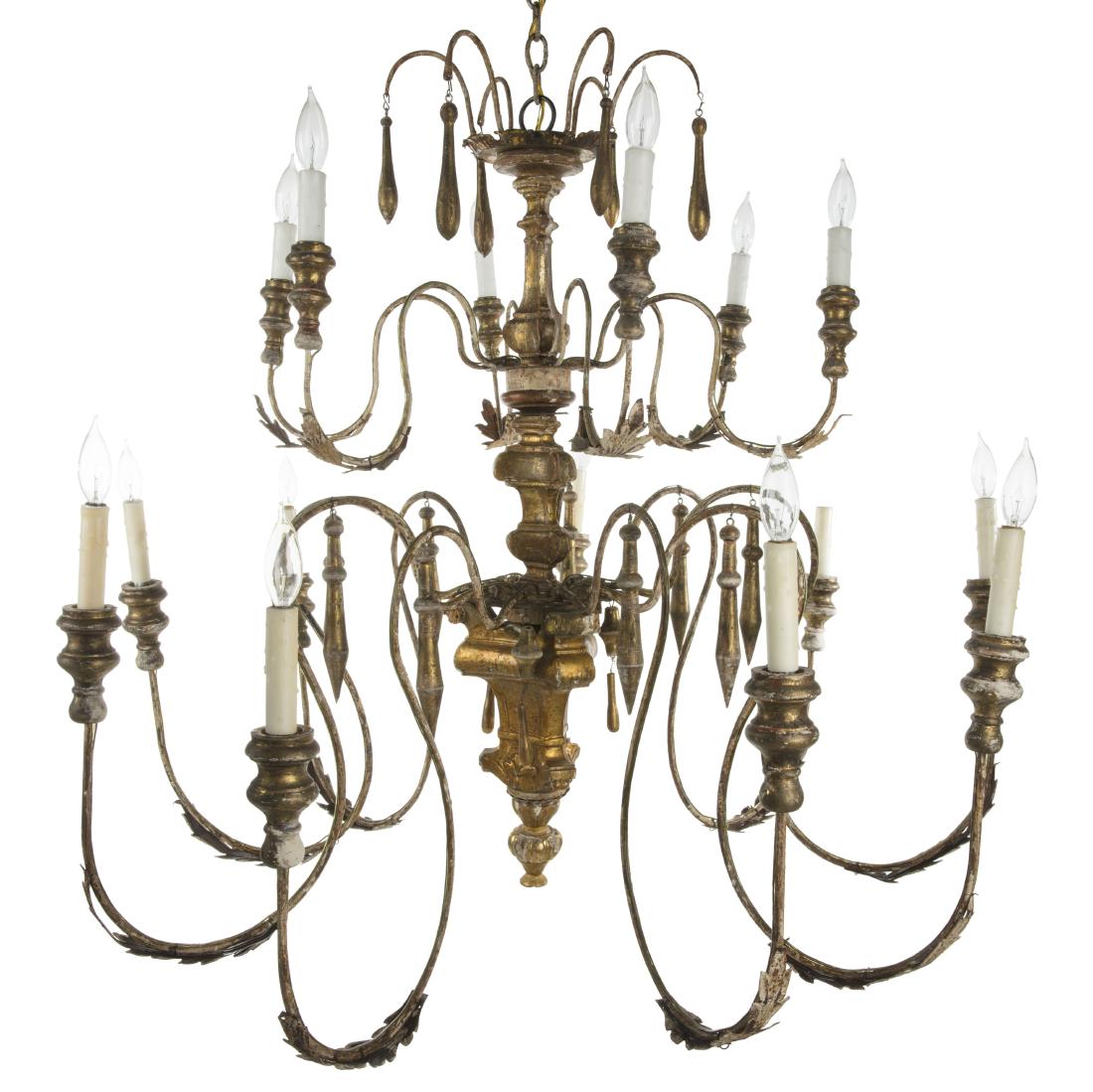 Italian Rococo style giltwood & tole chandelier: An Italian Rococo style carved giltwood and tole fourteen light chandelier 20th century height 40in (101.5cm); diameter 45in (114cm) approximately