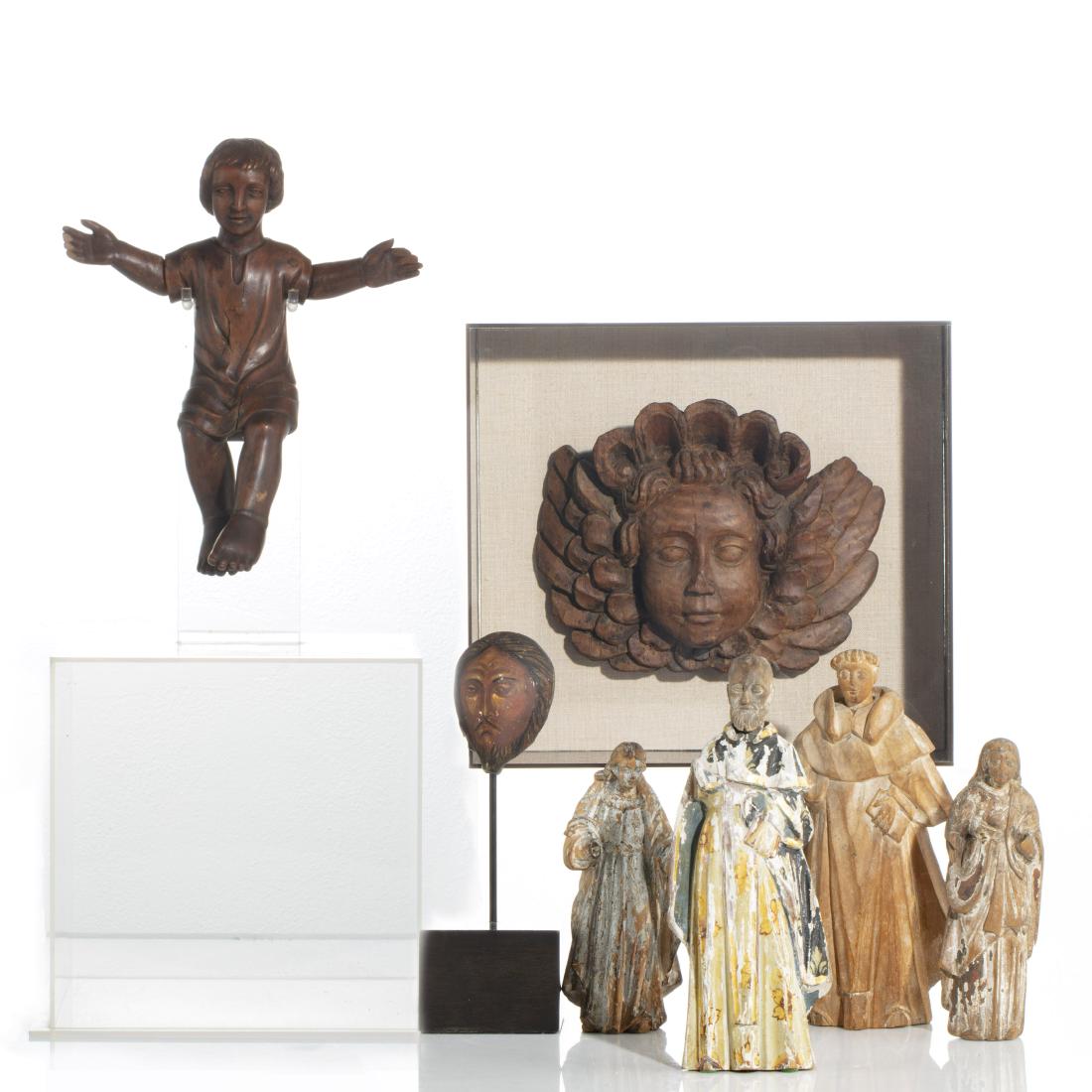 Group of Italian and Spanish carvings, 18th/19th c: A group of Italian and Spanish carvings 18th/19th century Comprising four painted Santos figures, a carved figure of the Christ child on lucite stand and a carved amorini in shadow box, together with