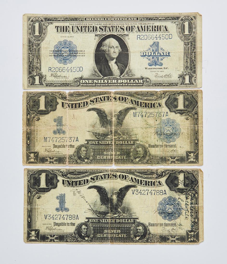 Three $1 large silver certificates (1 of 2)