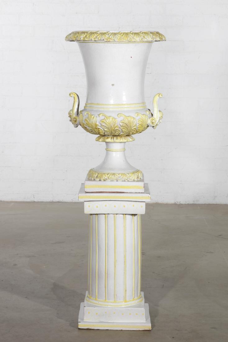 An Italian glazed earthenware urn on pedestal: An Italian glazed earthenware urn on pedestal 20th century overall height 54 3/4in (139cm); width 19in (48cm)Provenance: Property from a Private Collection, Laguna Beach, California.