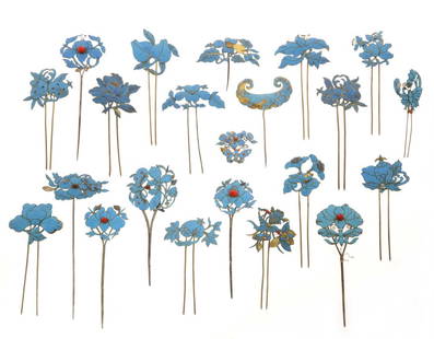 Group of Asian feather & metalware hair pins: A group of twenty-two Asian kingfisher feather applied metalware hair pins and ornaments late 19th/early 20th century Decorated as flowers and insects. varying sizes height 6in (15cm); width 3in (7.5c