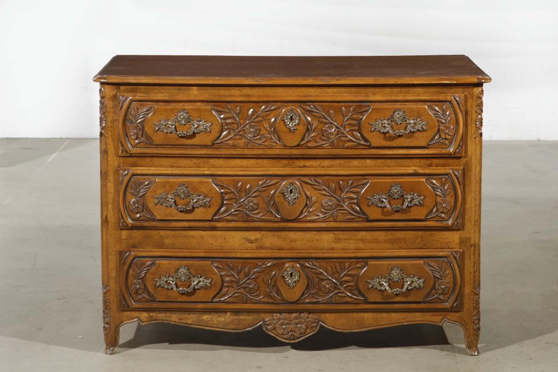 A Louis XV style carved mixed wood commode: A Louis XV style carved mixed wood commode post 1950 height 33 3/4in (85.5cm); width 47 1/4in (120cm); depth 23 3/4in (60.5cm)Provenance: Property from the Estate of Stephen L. Sayler, Newport Beach, 
