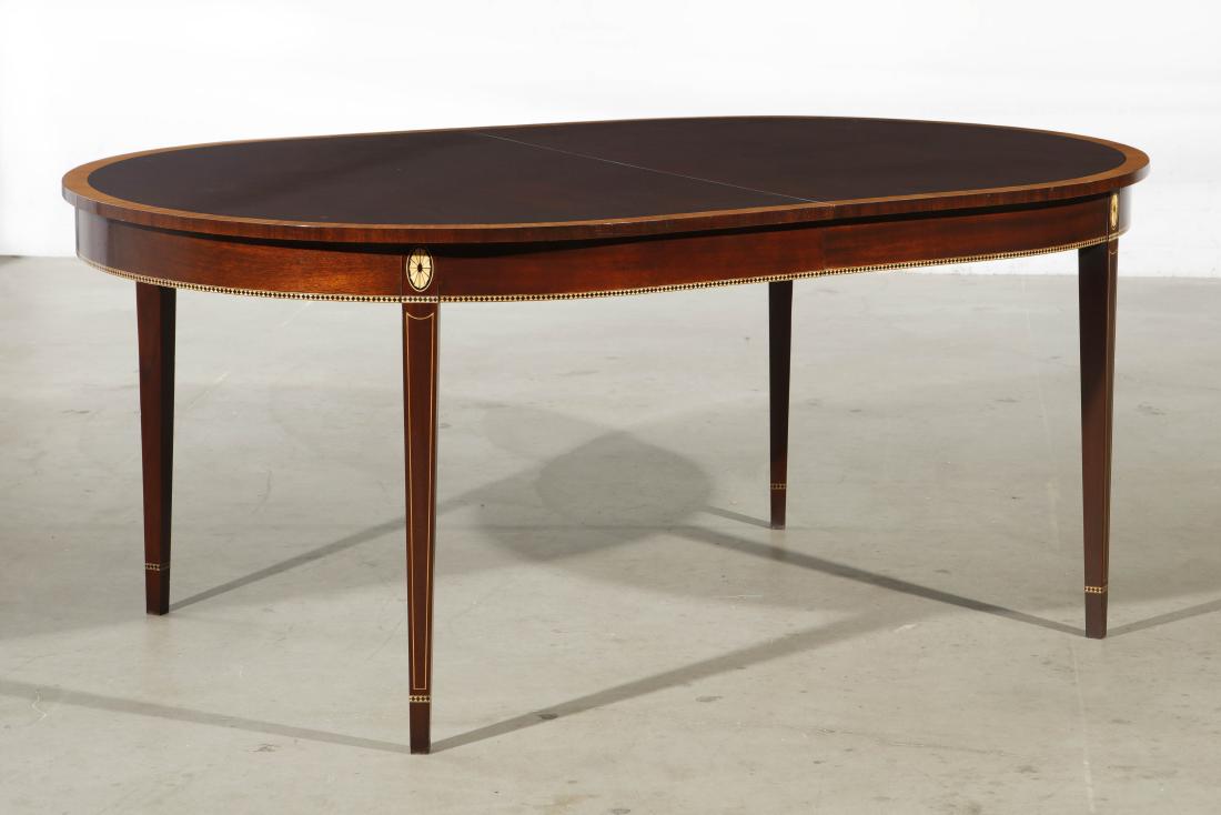 A George III style dining table, Stickley: A George III style inlaid mahogany dining table by Stickley modern With two leaves. height 30in (76cm); width 72in (183cm); depth 46in (117cm): length extended 104in (264cm)Provenance: Property from t