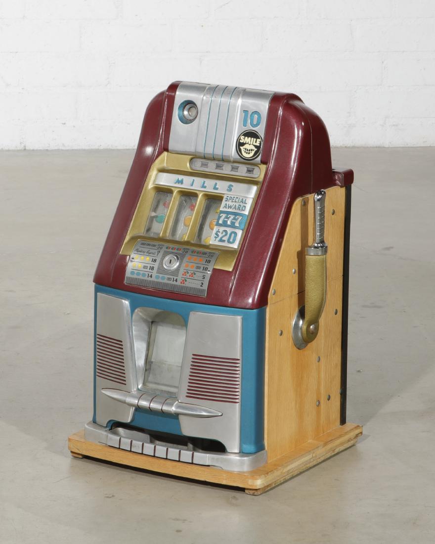 Mills 10 cent High Top Special Award slot machine: A vintage Mills 10 cent High Top Special Award slot machine circa 1950s height 25in (63.5cm): width 16in (41cm): depth 15in (38cm)
