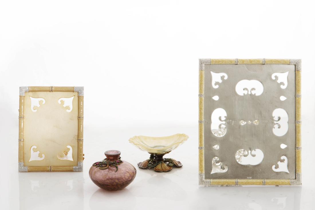 Four Jay Strongwater enamel table articles: A four piece collection of Jay Strongwater enamel table articles modern Comprising two graduated picture frames, a dragonfly-mounted glass vase and a oval footed glass dish. the larger frame height 10