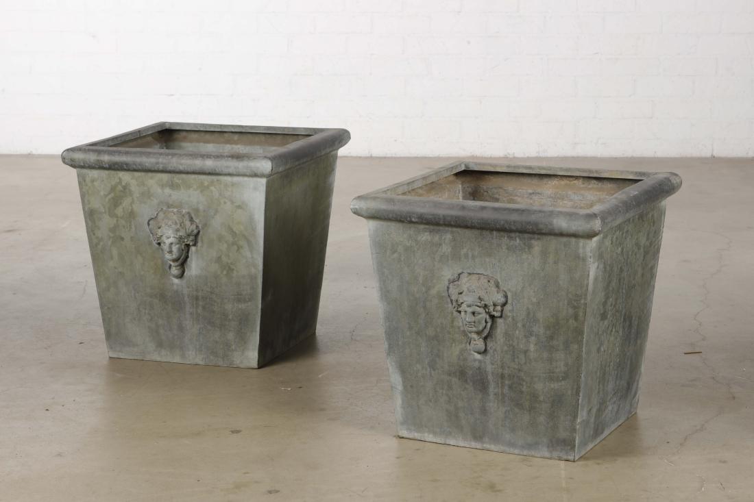 A pair of Neoclassical style zinc jardinieres: A pair of Neoclassical style zinc jardiniÃ¨res 20th century height 23 1/2in (59.5cm); width 24 1/4in (61.5cm); depth 24 1/4in (61.5cm)