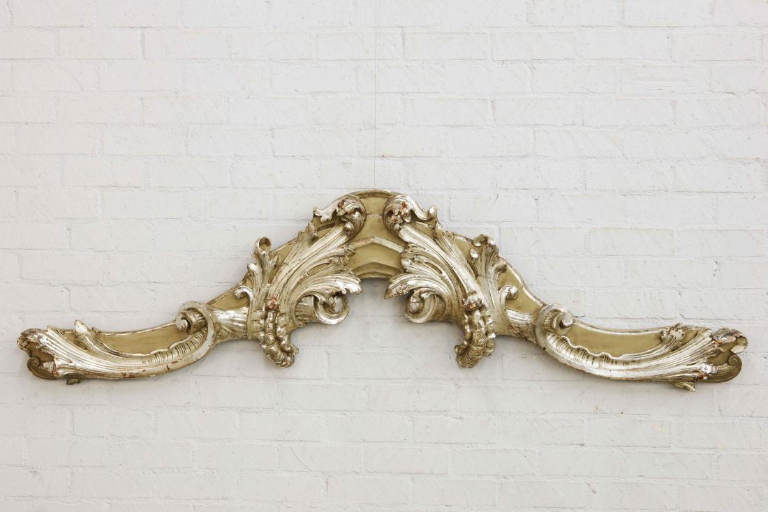 Rococo style silvered wood architectural element: A Continental Rococo style carved silvered wood architectural element height 24 1/4in (62cm); width 87in (221cm); depth 4in (10cm)