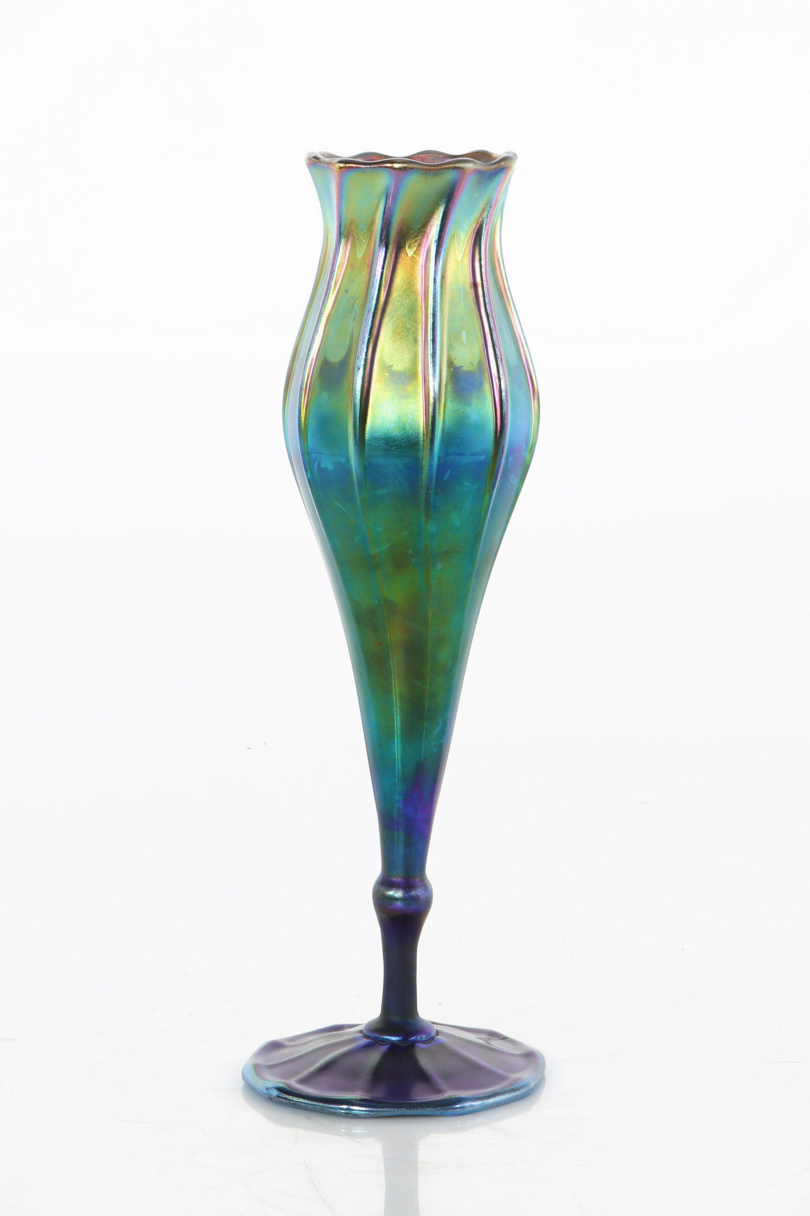 A Tiffany Studios blue Favrile glass vase: A Tiffany Studios blue Favrile glass vase New York, NY 1899-1919 Underside incised 3147 M L.C. Tiffany Favrile. height 11 1/2in (29cm)Provenance: Property from the estate of Marion Scharffenberger, Ro