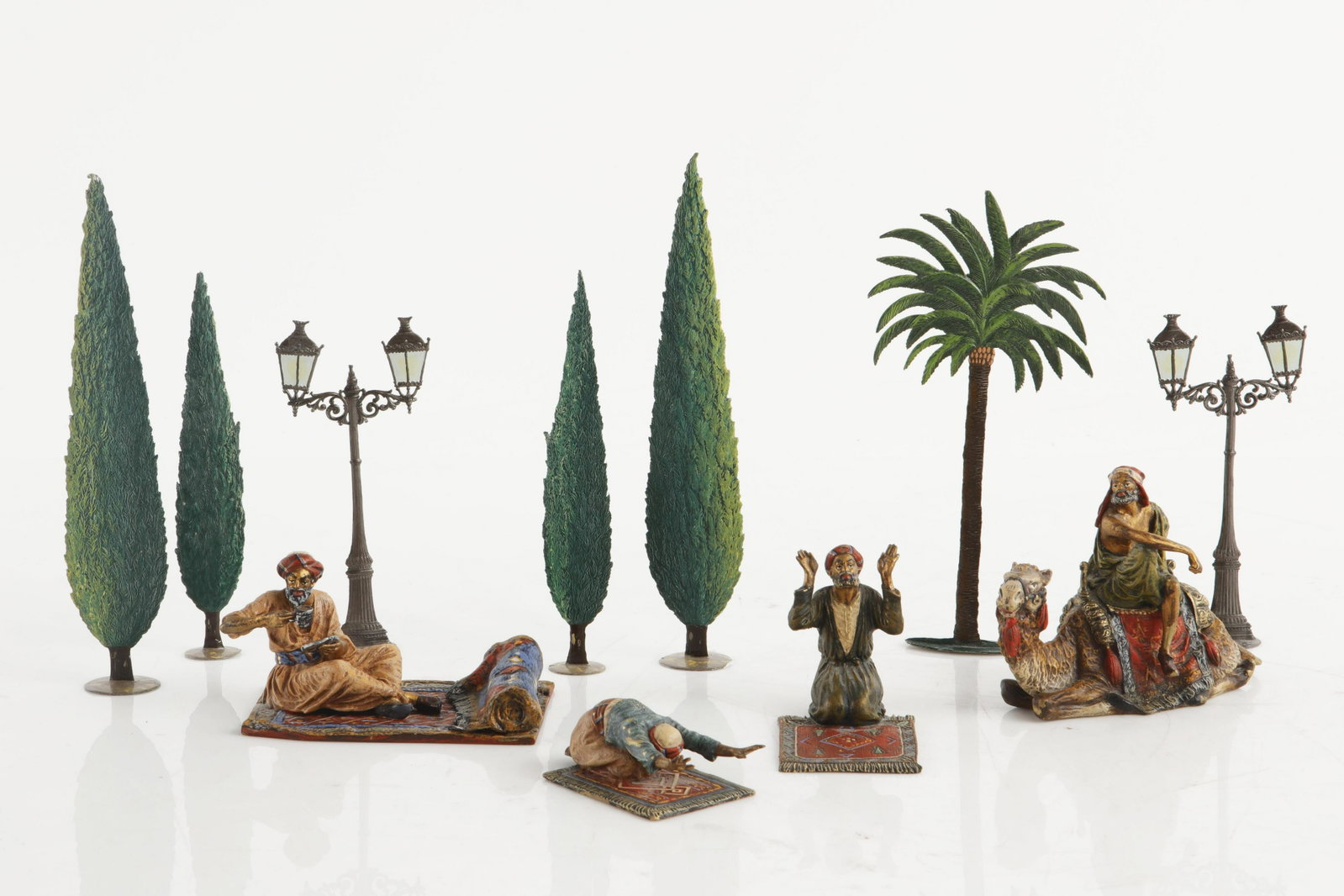 Four Austrian bronze figural groups, Fritz Bermann: Four Austrian cold painted bronze figural groups Fritz Bermann, Vienna 20th century Together with a collection of seven Wilhelm Schweitzer painted pewter models of trees and street lamps (11). the lar
