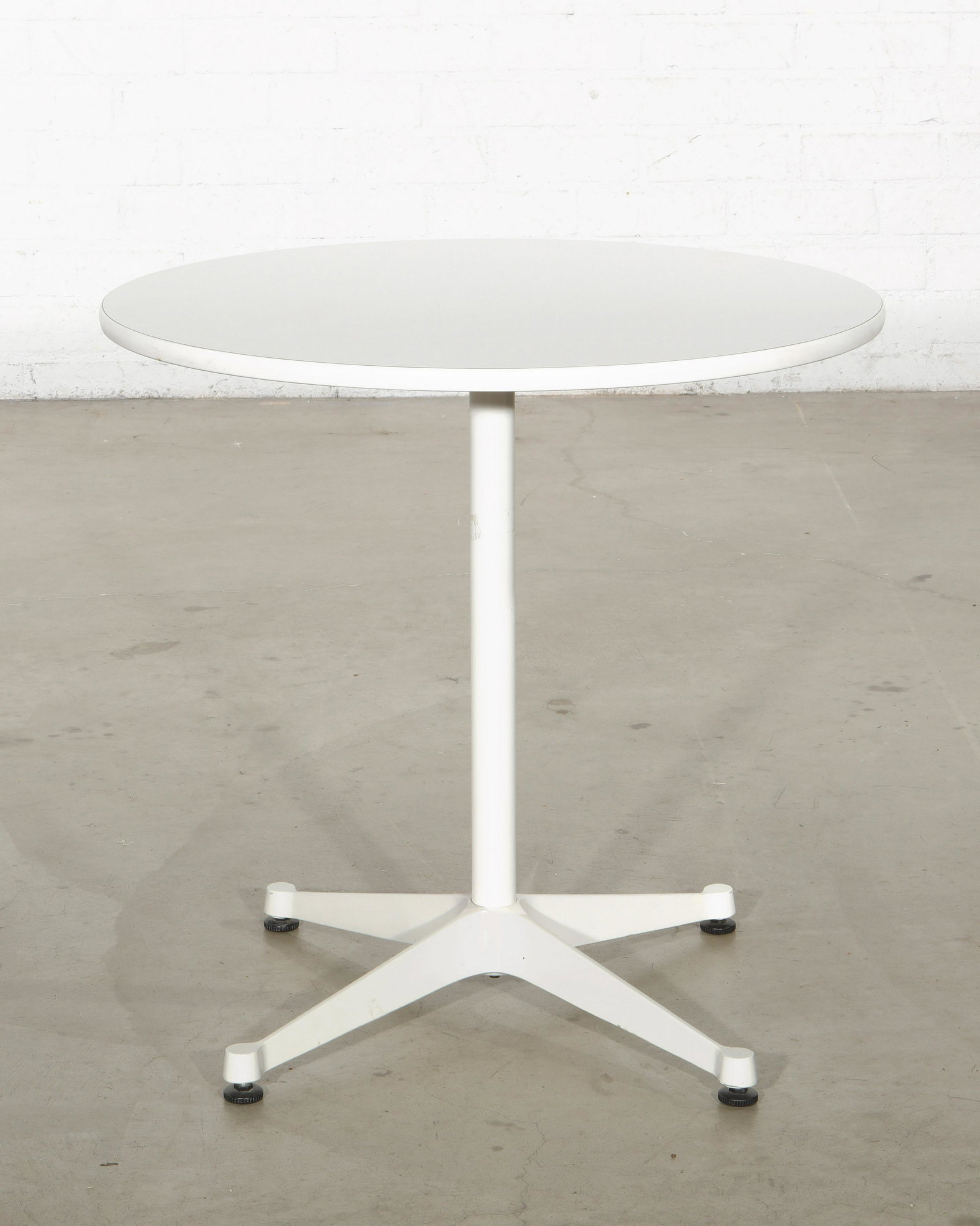 Design Within Reach dining table, Eames for Miller: A Design Within Reach dining table designed by Charles and Ray Eames for Herman Miller modern height 28 3/4in (73cm); diameter 29 3/4in (75.5cm)