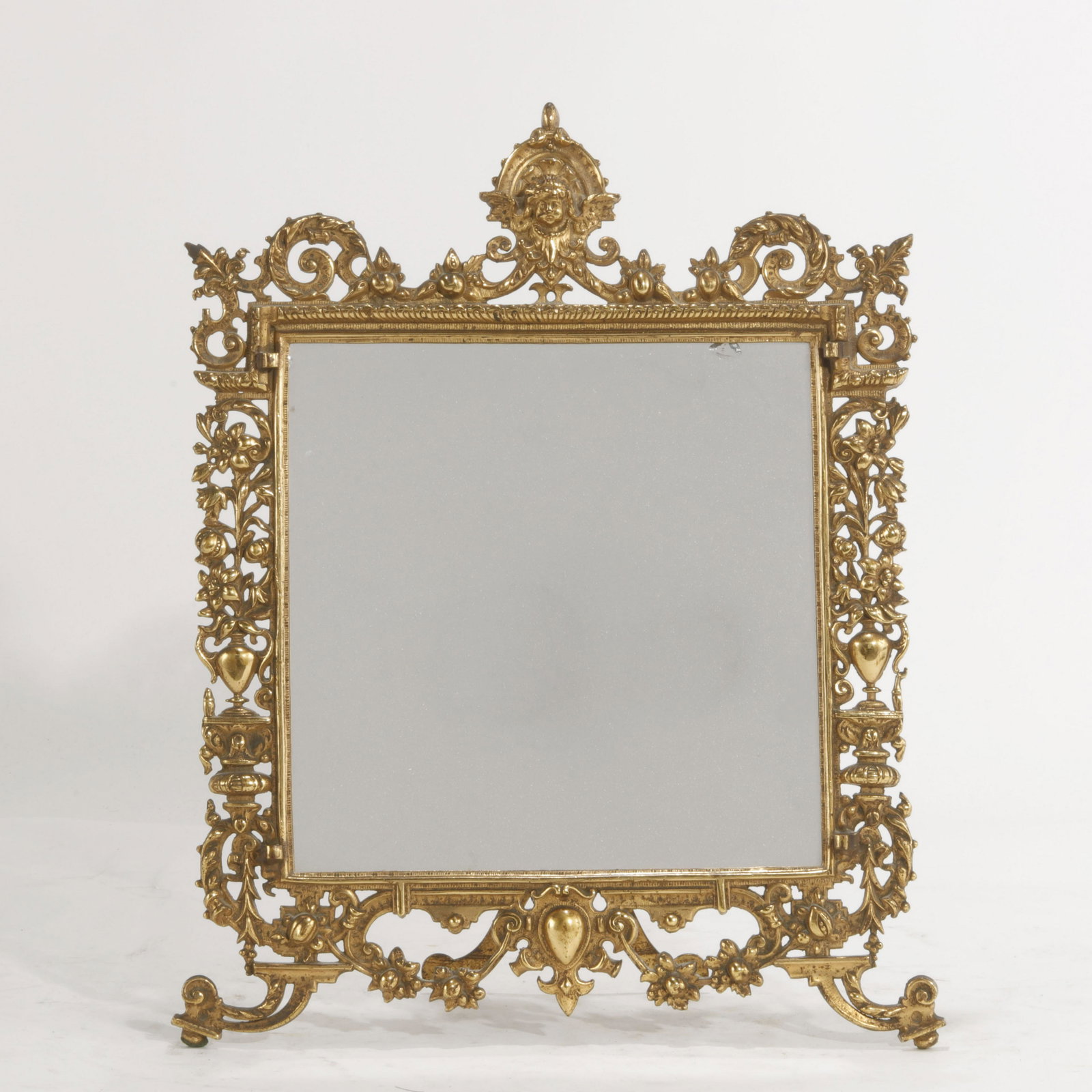A Continental Baroque style table top mirror: A Continental Baroque style table top mirror late 19th/early 20th century height 17Iin (43cm); width 13in (33cm)