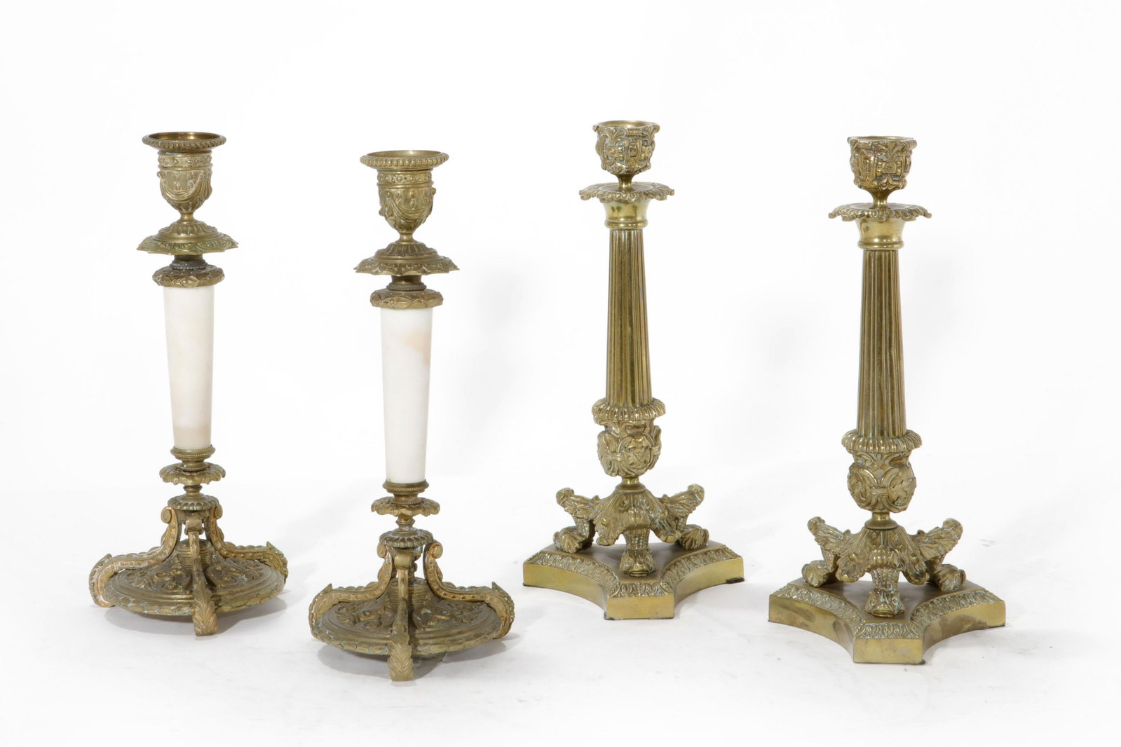 A pair of Charles X gilt bronze candlesticks: A pair of Charles X gilt bronze candlesticks second quarter 19th century Together with a pair of gilt bronze and marble candlesticks. height 11in (28cm)Provenance: Property from The McNally Company An