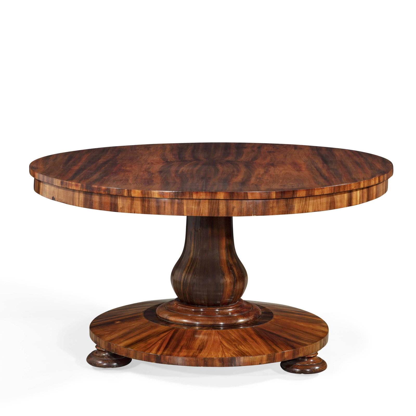A George IV hardwood tilt top breakfast table: A George IV hardwood tilt top breakfast table circa 1825 height 29 1/2in (75cm); diameter 54 1/4in (138cm) Provenance: Property from a Collector, New York City.