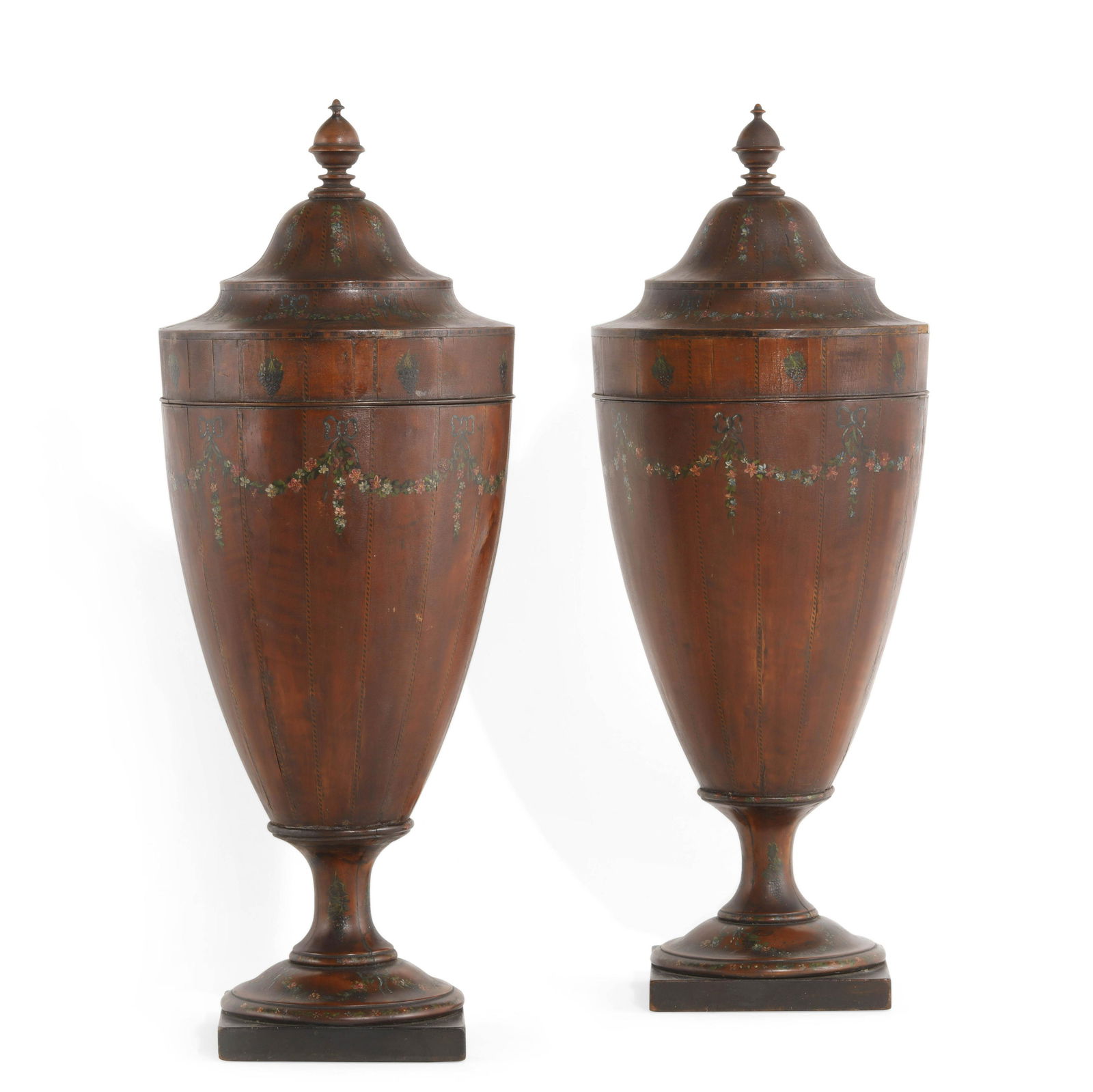A pair of George III style mahogany knife urns: A pair of George III style paint decorated mahogany knife urns circa 1900 Remnants of an old paper label inscribed Property of the Metropolitan Museum of Art. height 27 1/2in (70cm); diameter 10 1/4in