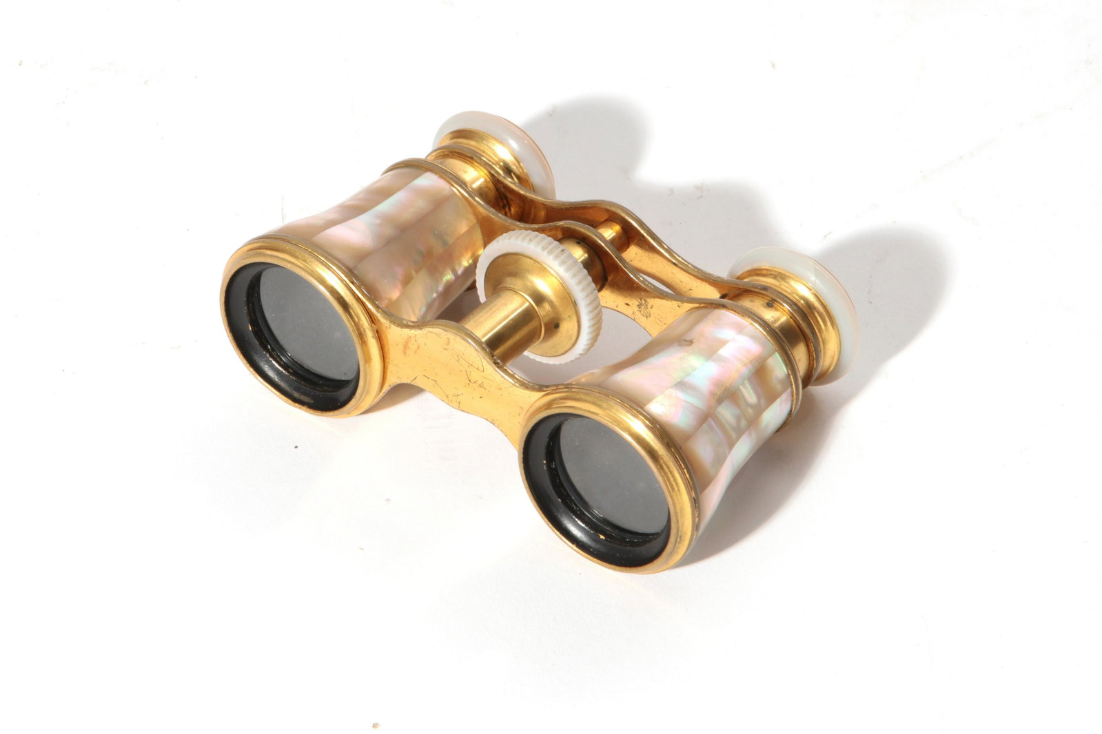 A pair of French metal opera glasses, Lemaire: A pair of French mother of pearl mounted gilt metal opera glasses Lemaire, Paris late 19th/early 20th century width 3 3/4in (9.5cm)