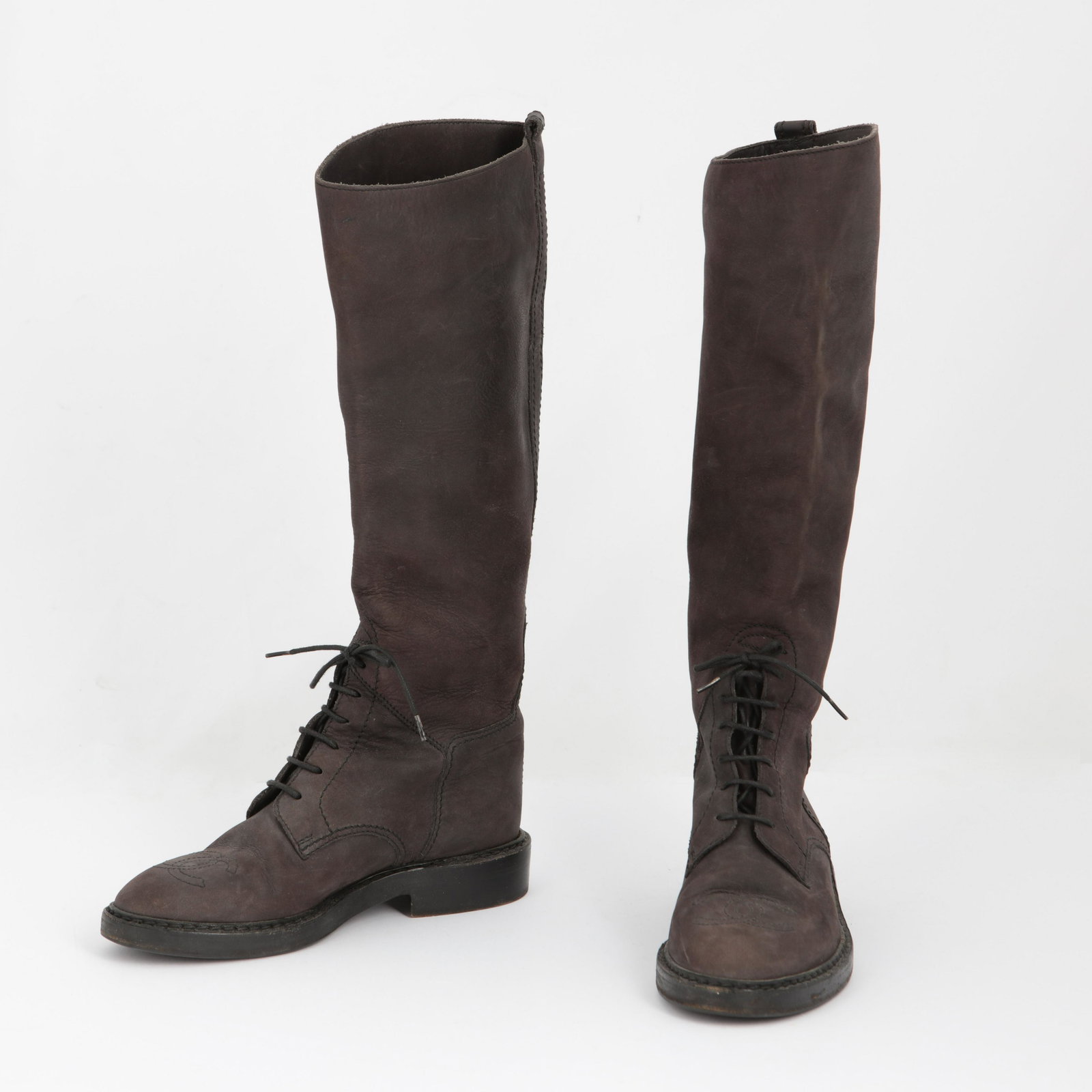 Chanel gold platform sneakers and leather boots: A pair of Chanel gold platform sneakers, size 37 together with a pair of Chanel brown leather boots, no size label Sneakers with classic CC logo to top of toe, the boots in a riding style, with shoe c