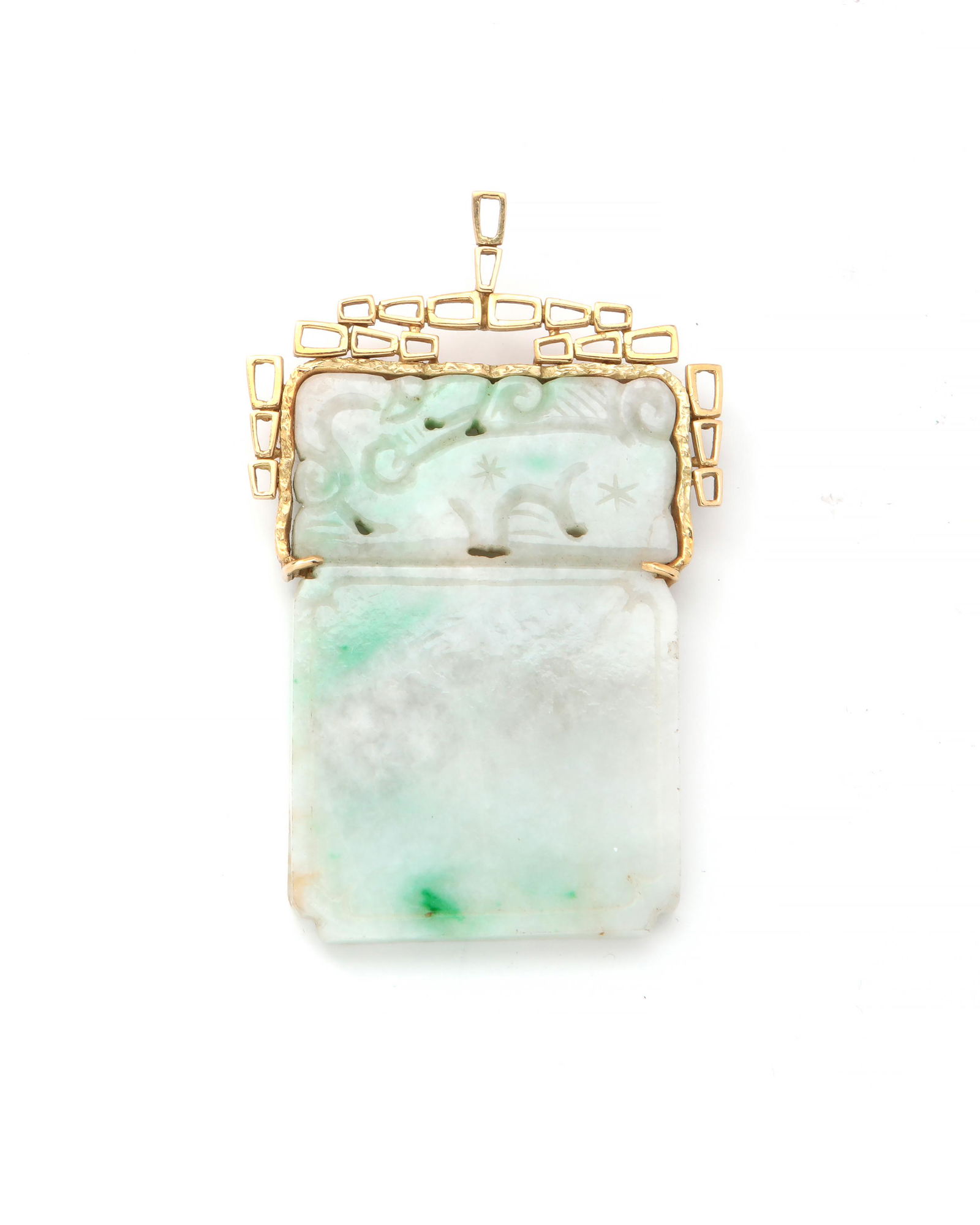 A jadeite and 18K gold pendant: A jadeite and 18K gold pendant Rectangular slab, carved and pierced, set within an open-work frame with a 14K gold pinstem and catch; stamped T-Z 18K (Terrel & Zimmelman). 3 ¼ x 2in (8.25 x 5cm