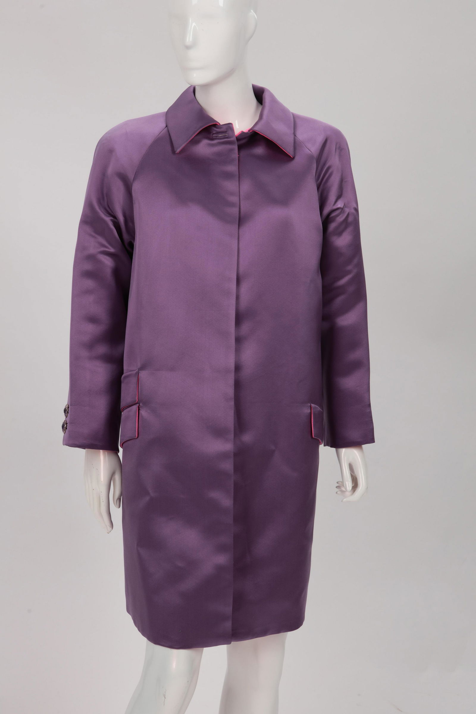 A Gianni Versace lavender coat: A Gianni Versace lavender coat, no size labels 1980s Coat with hot pink lining and ornamental double diagonal pockets at hip to one side and another to other side in a wool and silk blend.