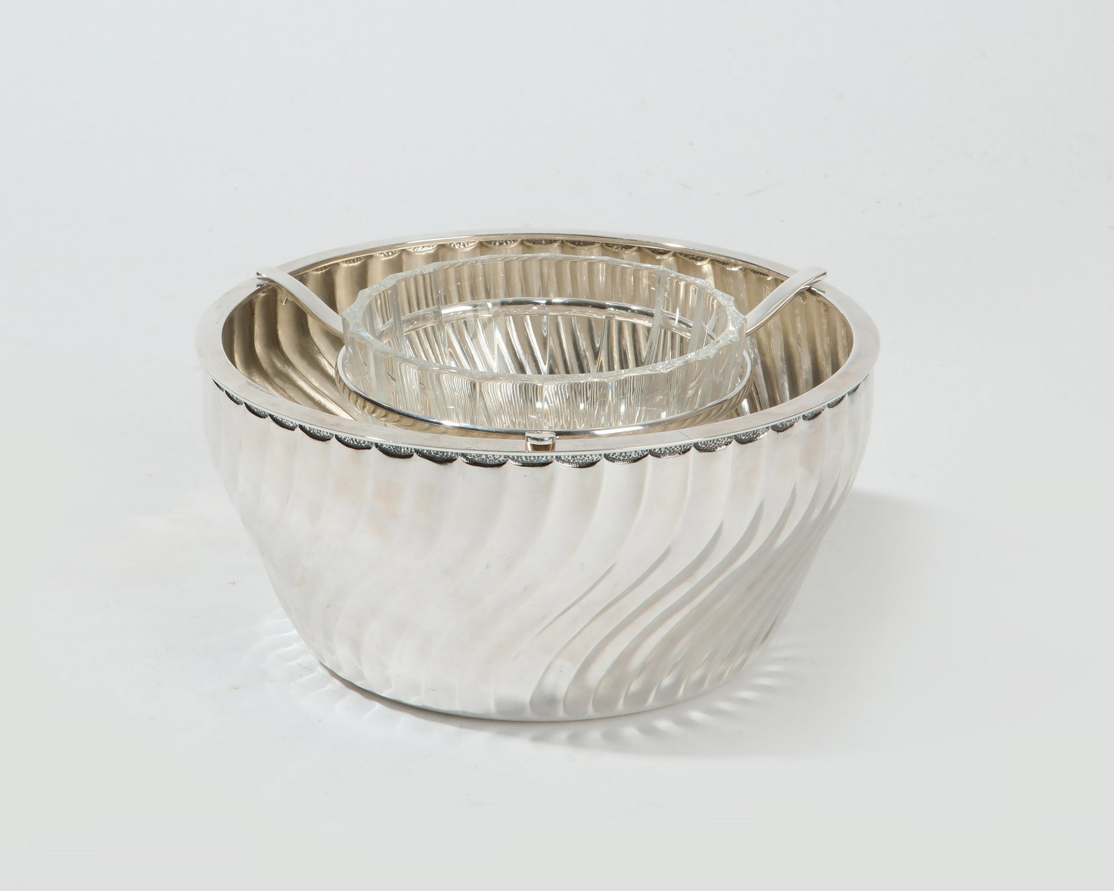 A Buccellati silver and cut glass caviar server: A Buccellati sterling silver and cut glass caviar server Milan modern height 3 1/2in (9cm); diameter 7in (17.75cm); silver weight approximately 16oz troy