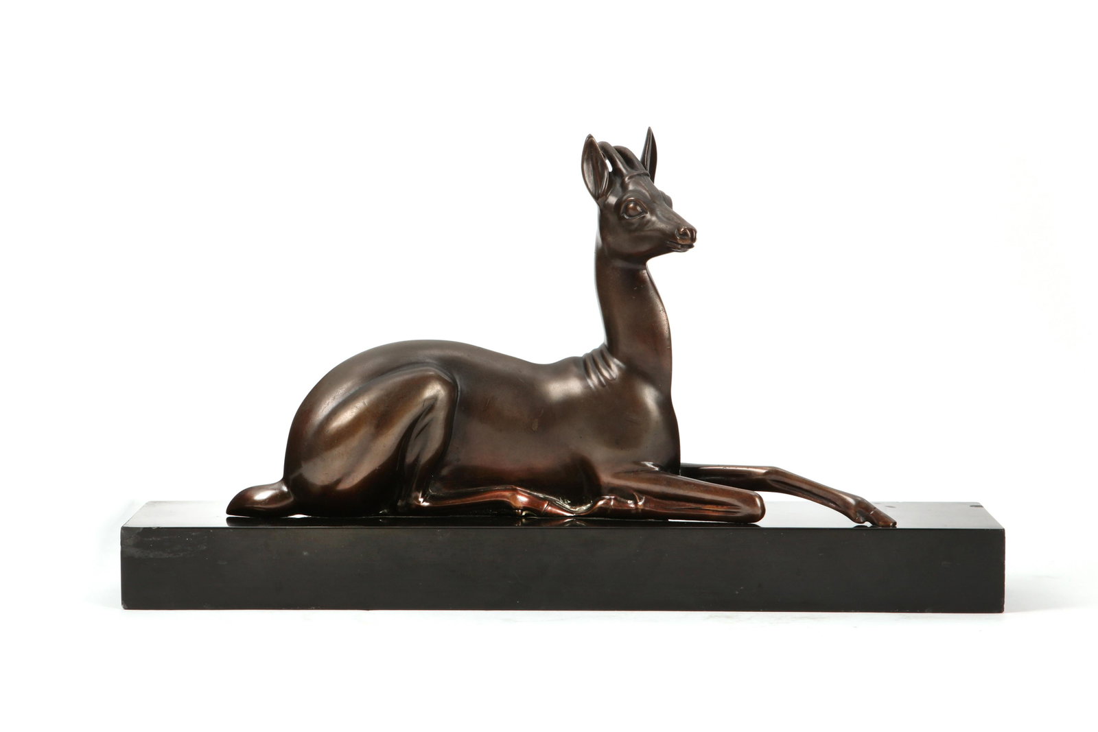 A bronze model of an antelope, after Larroff: A Continental patinated bronze model of an antelope on slate base after a model by Georges Larroff (Russian, 1895-1991) 20th century Incised G. Larroff, impressed MARCEL GUILLEMAN 6C BRONZE. height of
