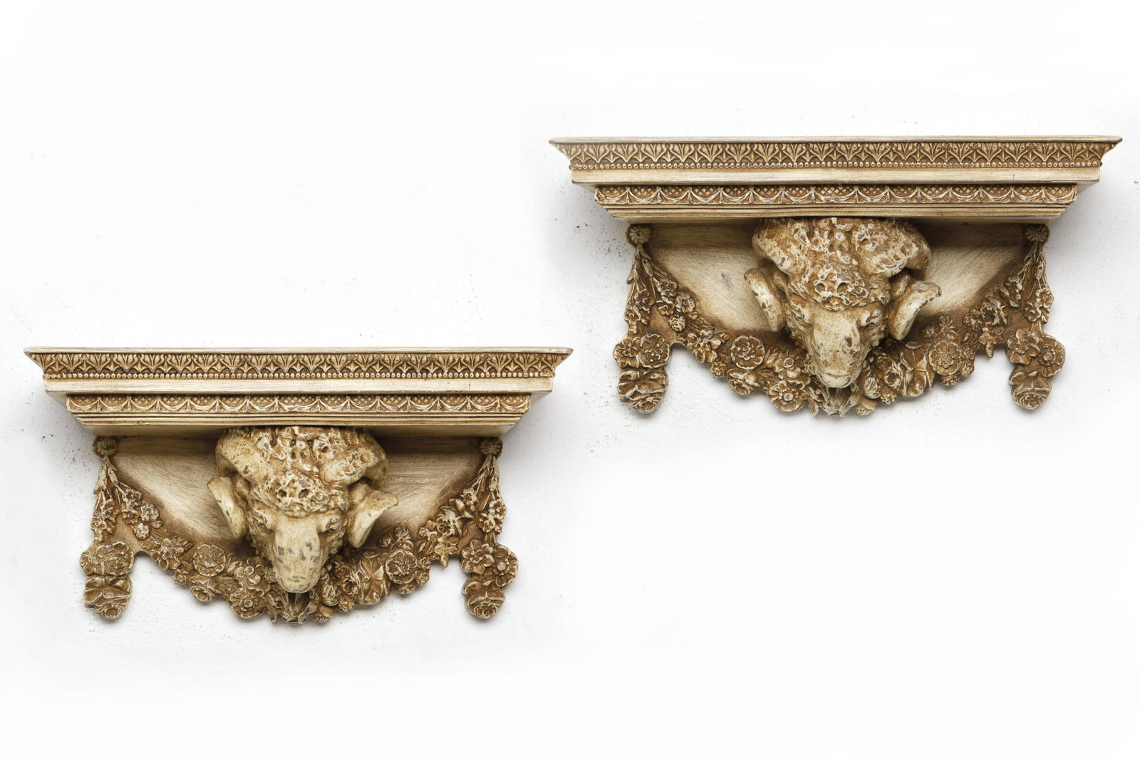 A pair of wall brackets with ram head supports: A pair of Neoclassical style wall brackets with ram head supports 20th century height 9in (23cm); width 17 1/2in (44.5cm); depth 8in (20cm)Provenance: Property from The McNally Company Antiques, Ranch