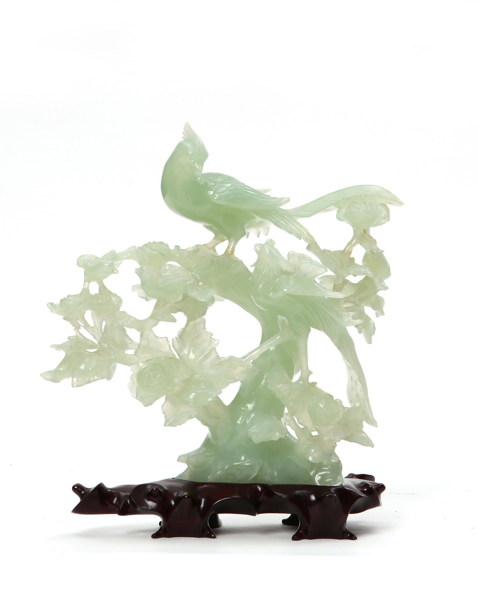 A Chinese green stone group of pheasants: A Chinese green stone group of pheasants On stand. overall height 9in (23cm) Provenance: Property from the Collection of Yasuko and Maury Kraines.